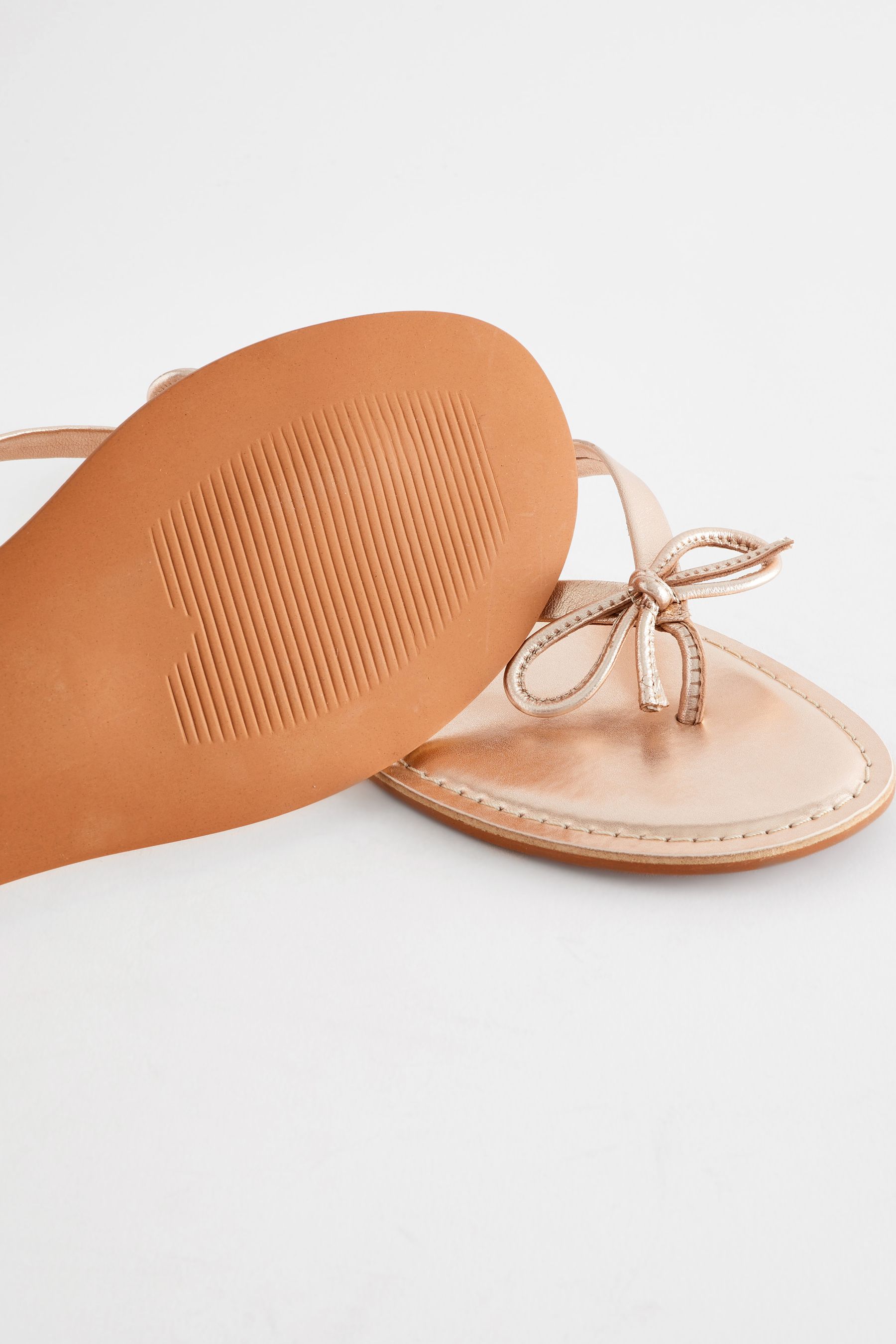 Buy Rose Gold Standard Wide Fit Forever Comfort Bow Detail Leather Flip Flops from the Next UK online shop
