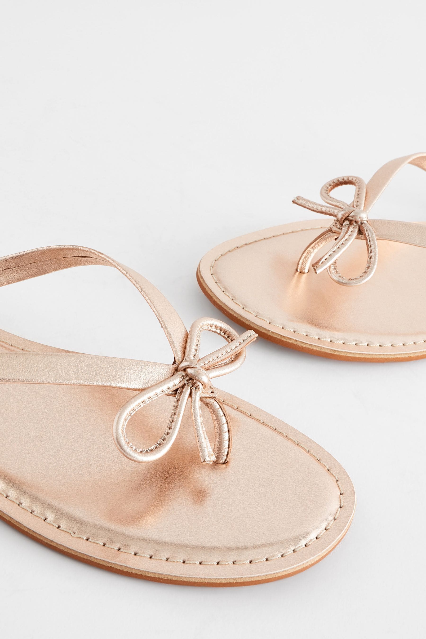 Buy Rose Gold Standard Wide Fit Forever Comfort Bow Detail Leather Flip Flops from the Next UK online shop