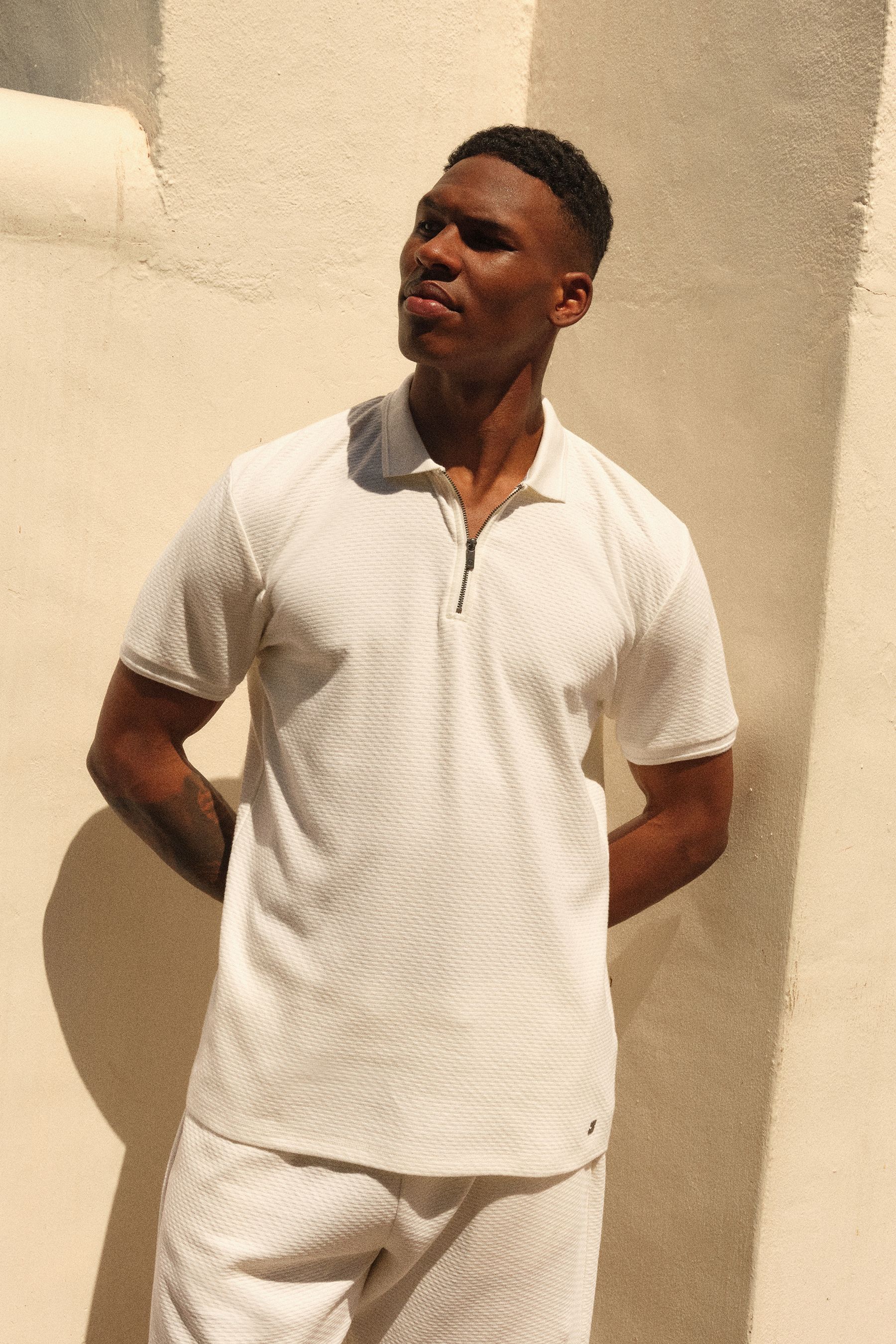 Buy White Short Sleeve 100 Cotton Textured Quarter Zip Polo Shirts from the Next UK online shop