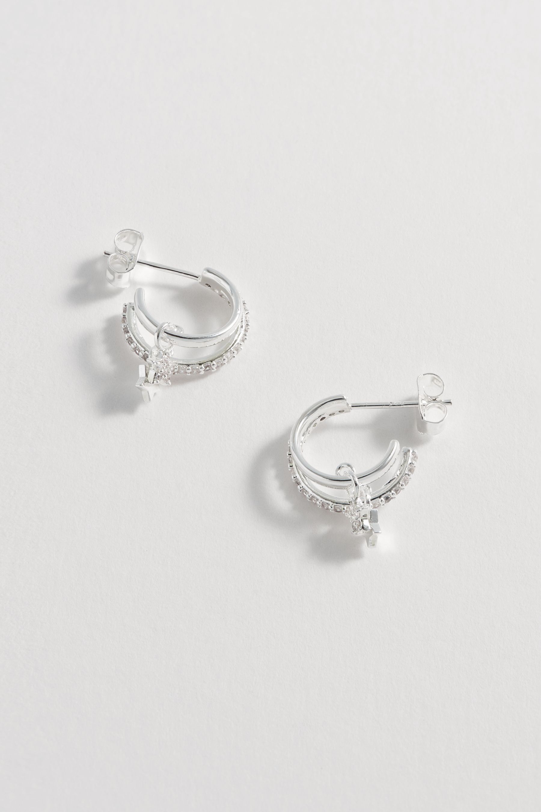 Buy Estella Bartlett Silver Tone Duo Pave Star Hoops from the Next