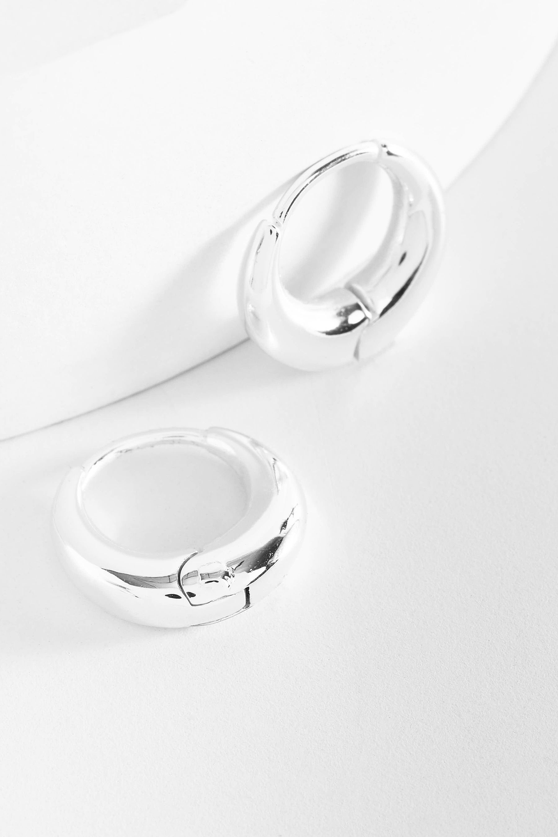 Stainless steel huggie sale earrings