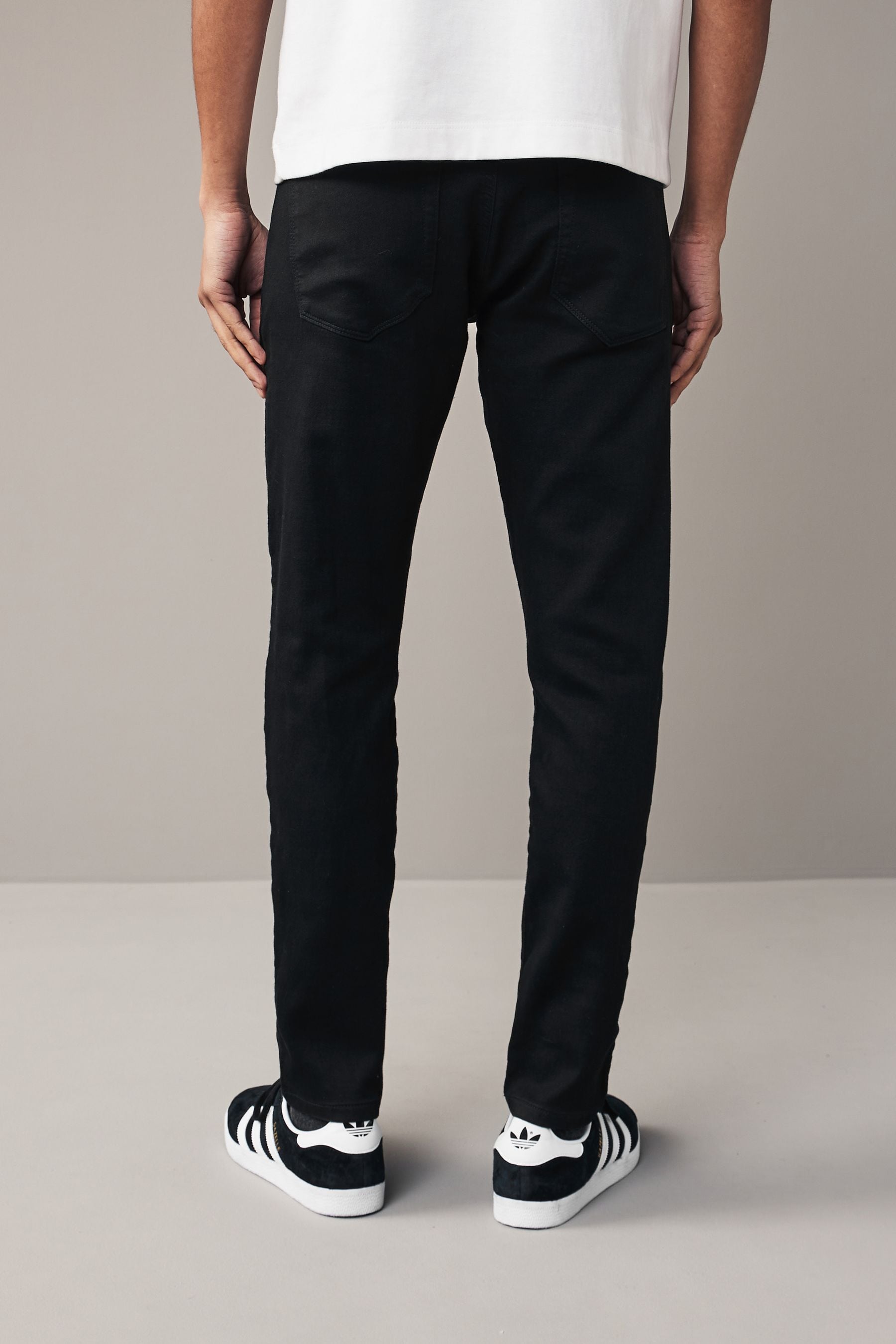 Buy Solid Black Skinny Comfort Stretch Jeans from the Next UK