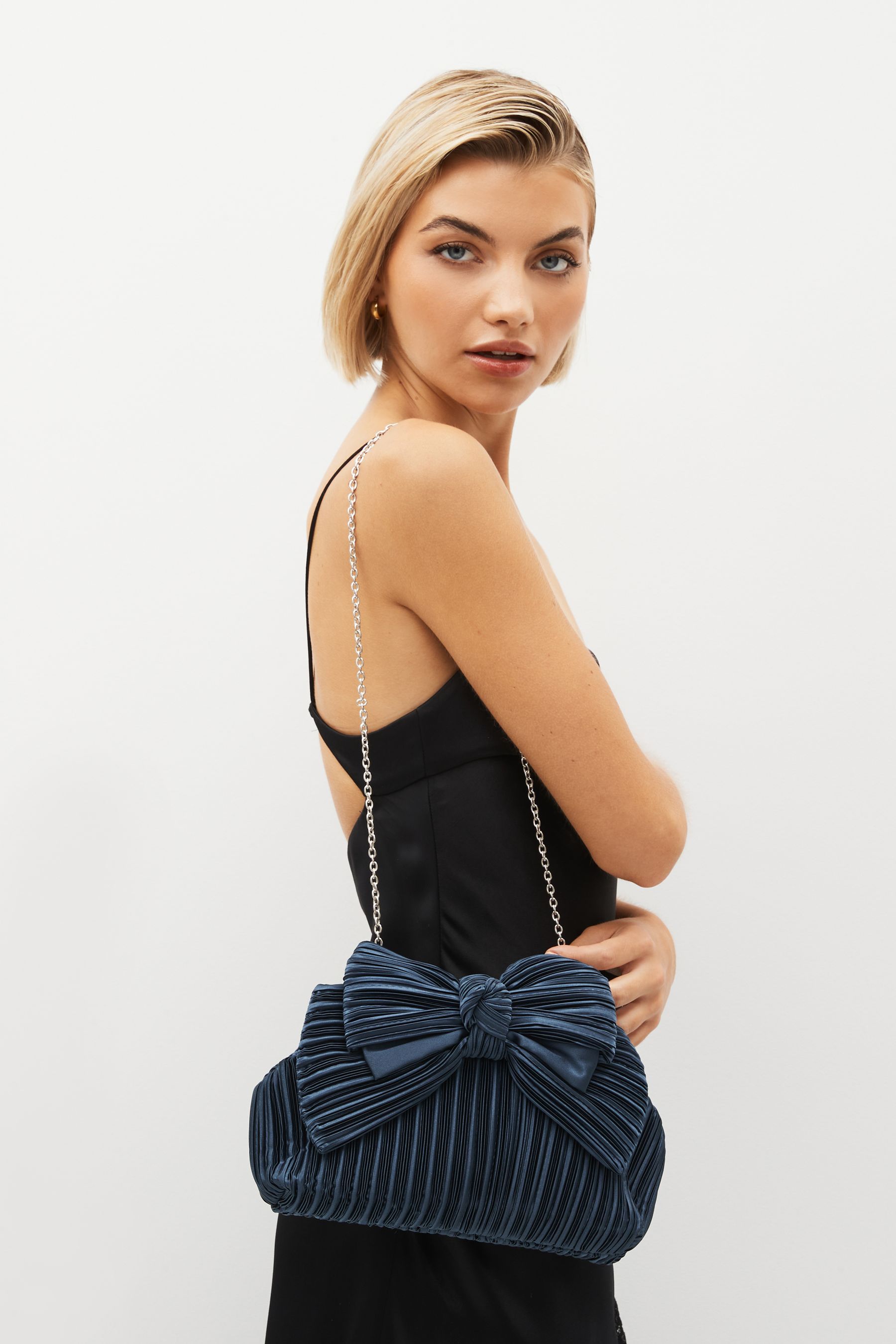 Bow clutch bag store