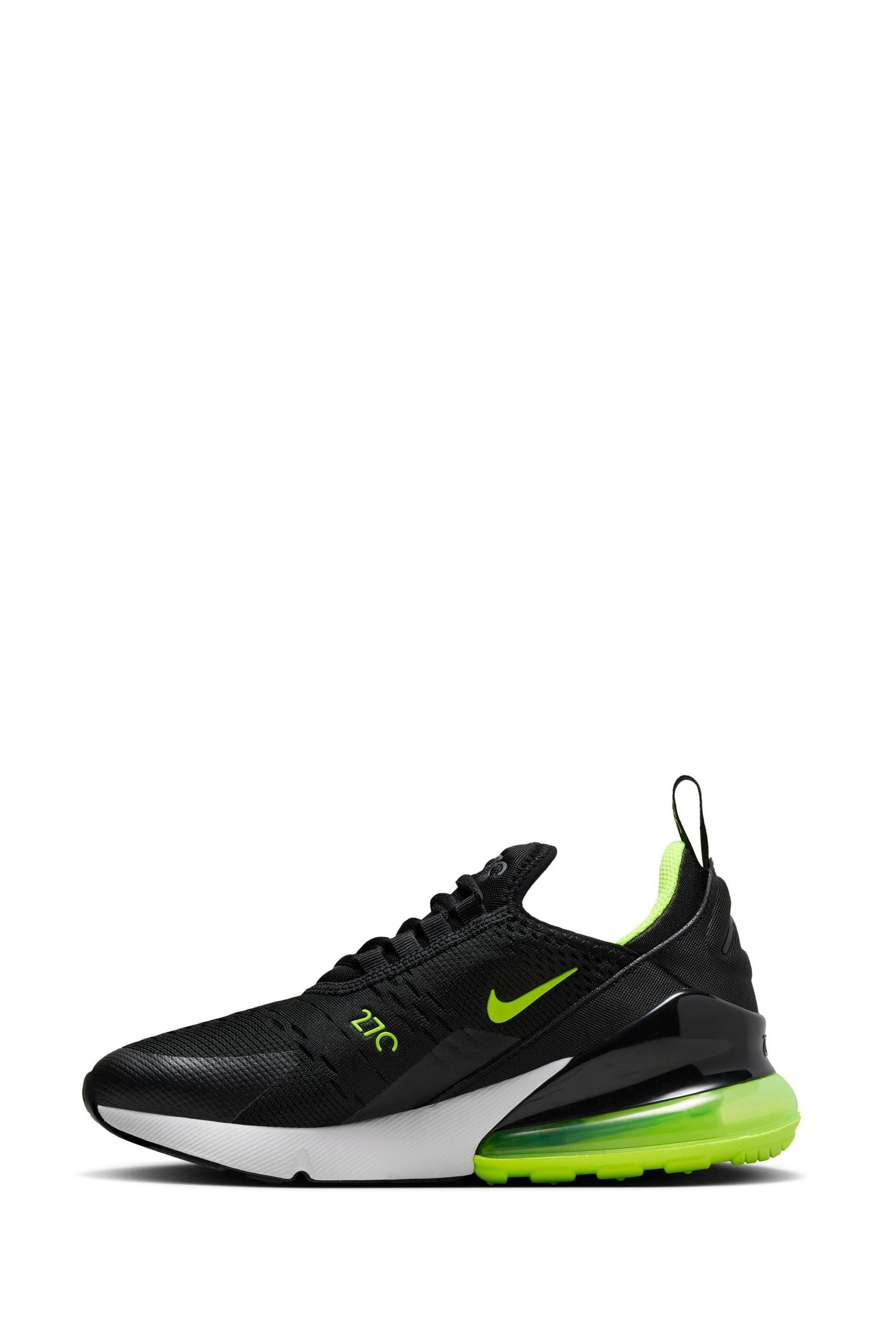 Nike black and green trainers hotsell