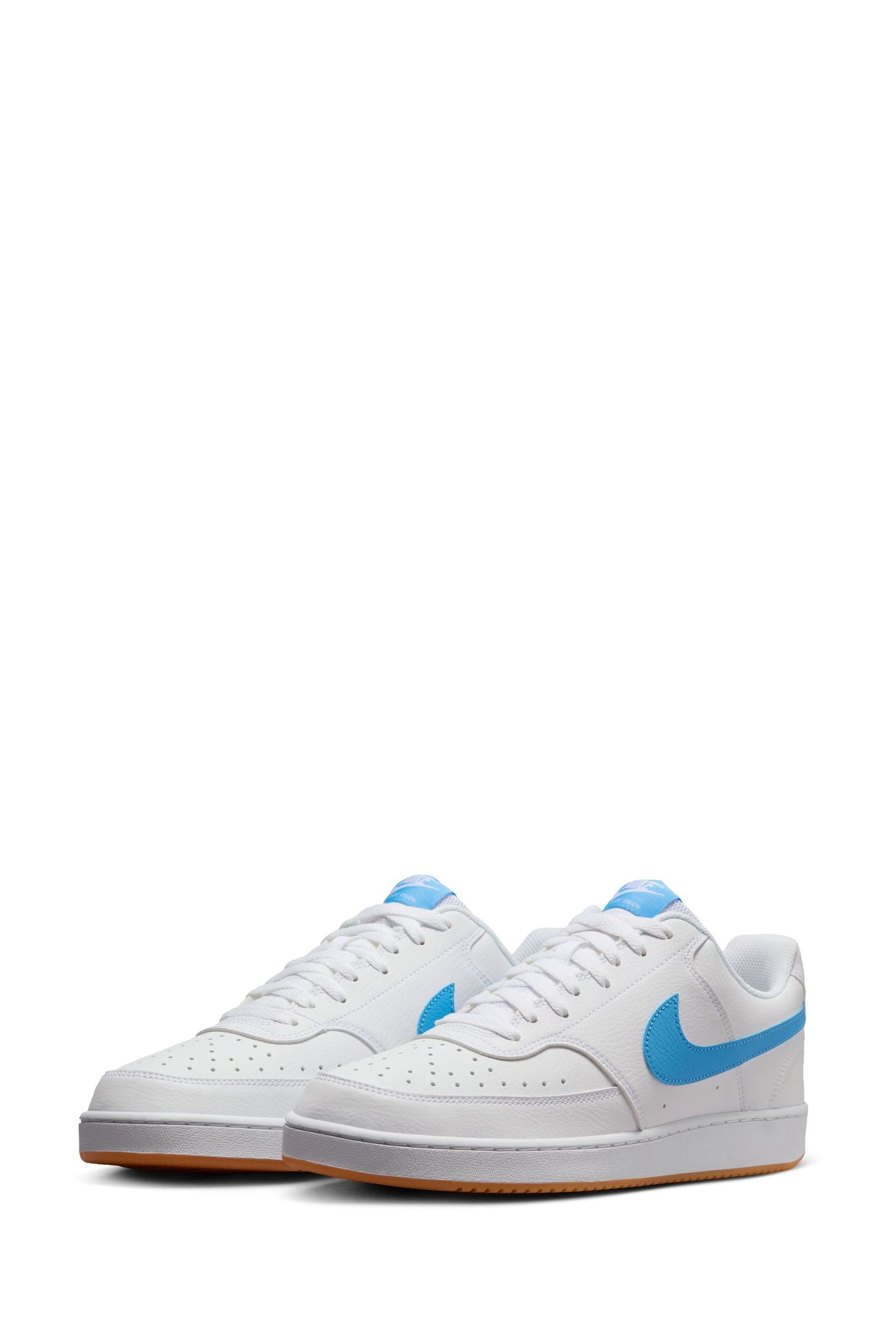 Nike white with blue swoosh hotsell