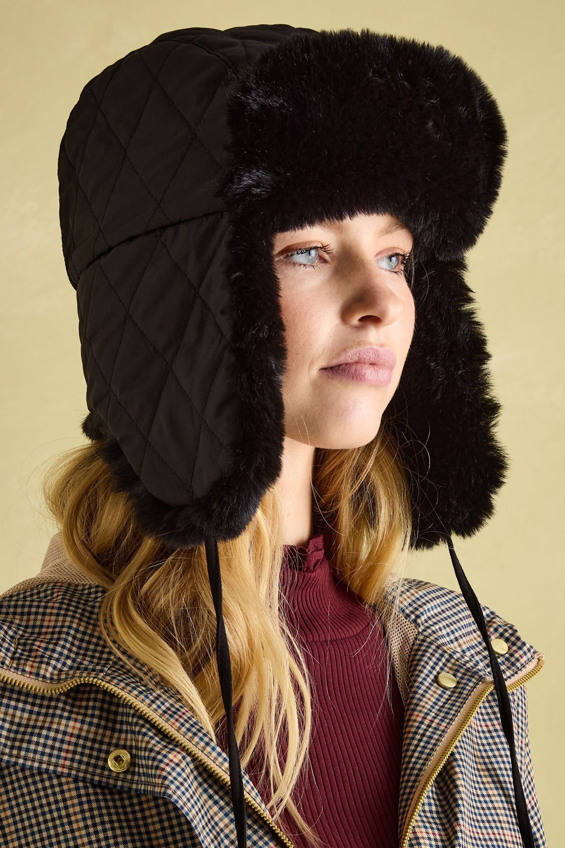 Buy Joules Eira Black Faux Fur Lined Quilted Trapper Hat from Next Australia