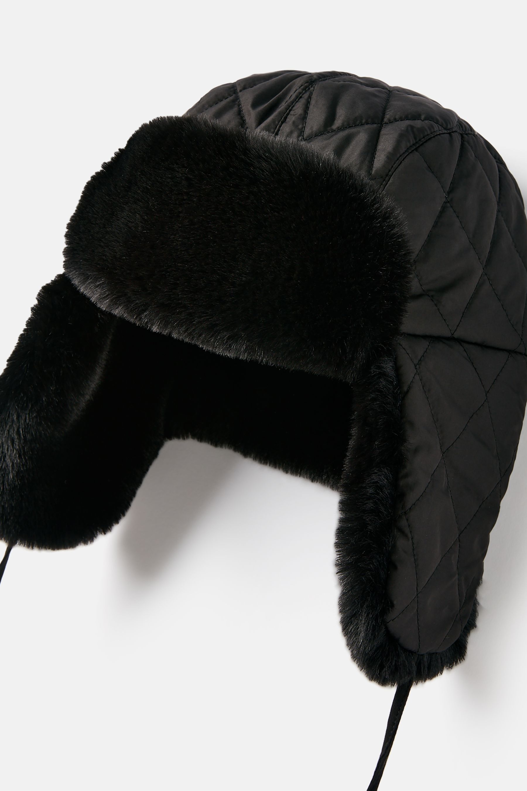 Buy Joules Eira Black Faux Fur Lined Quilted Trapper Hat from Next Malta