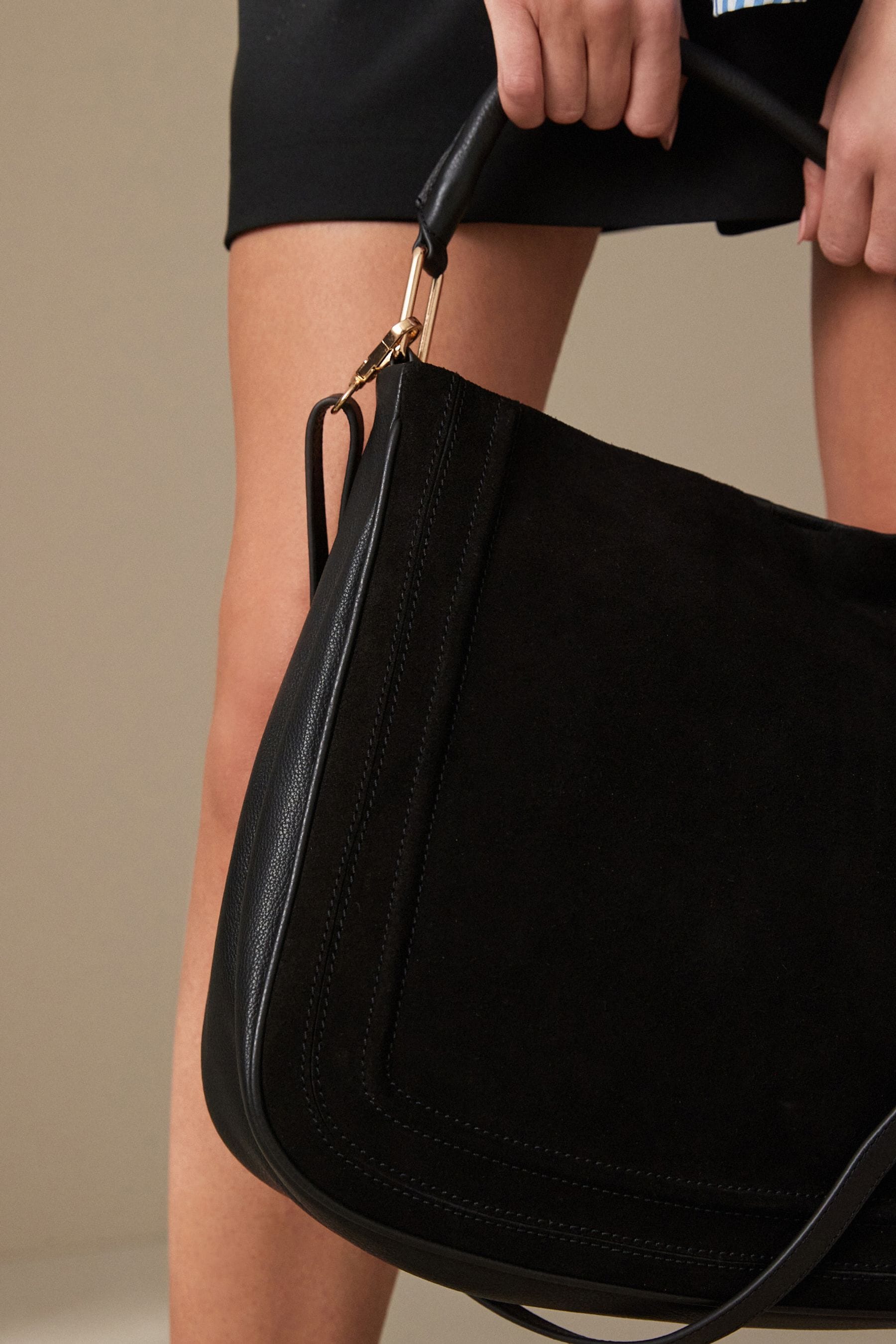 Black suede messenger bag top