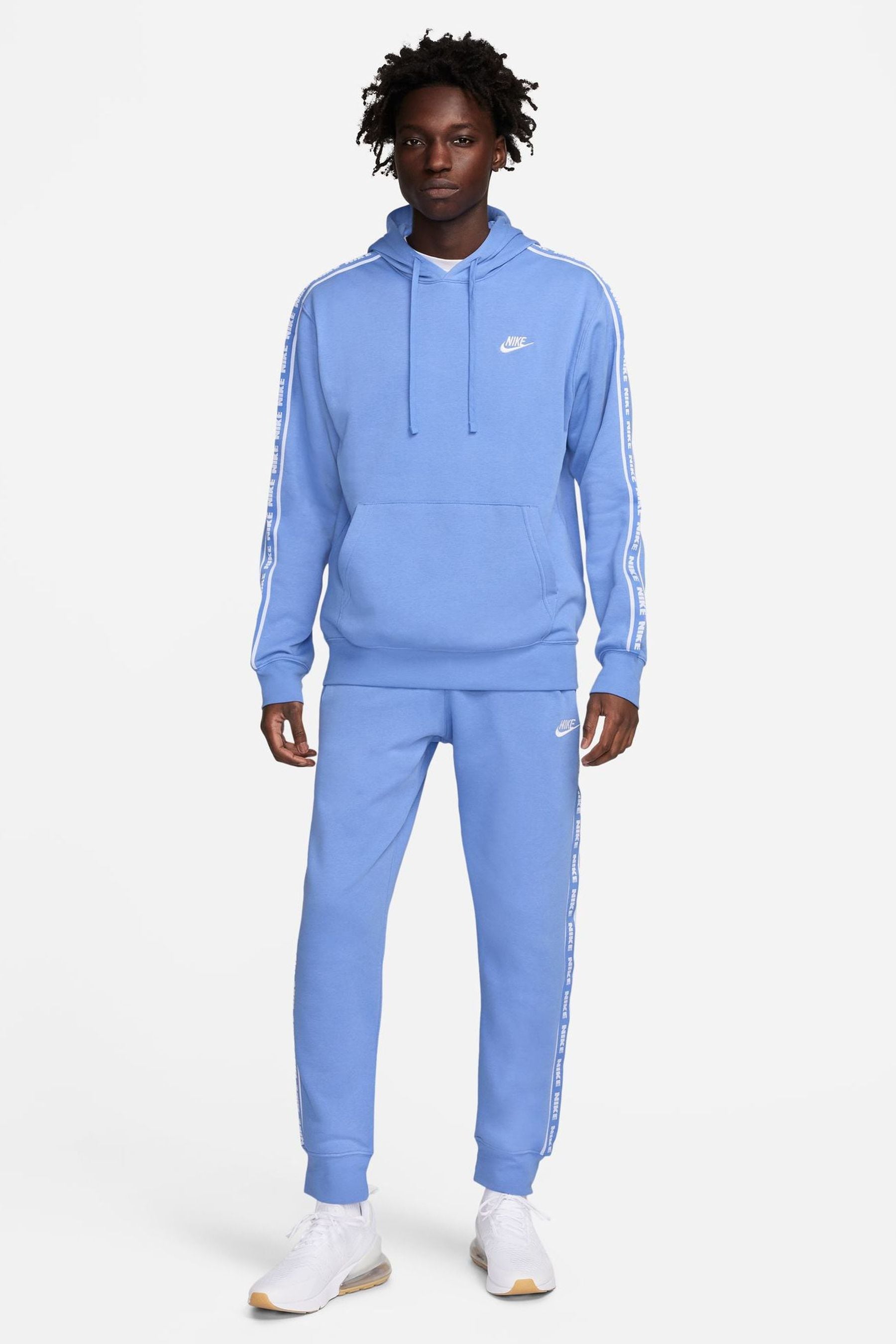 Light blue sale nike tracksuit