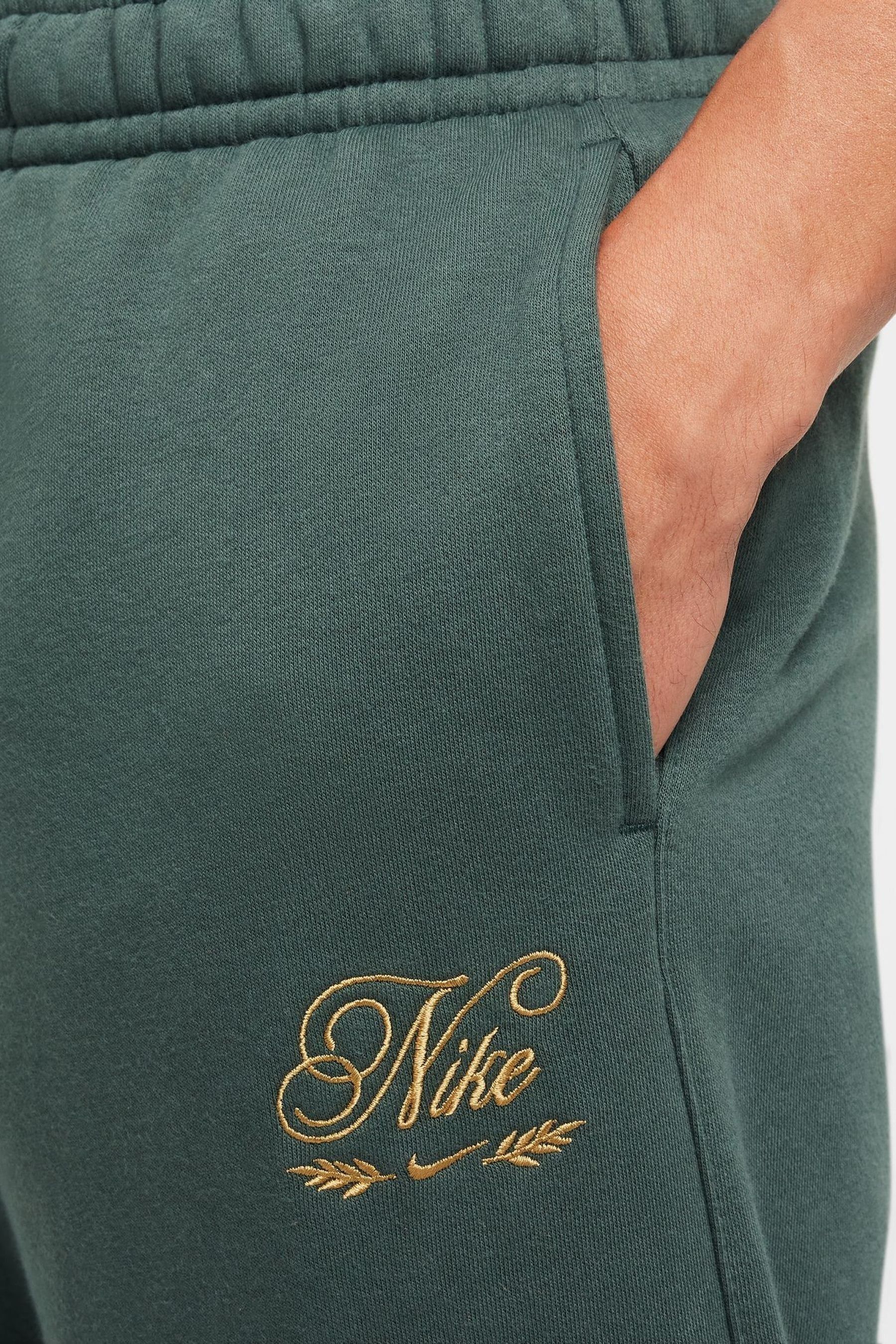 Buy Nike Vintage Green Club Embroidered Cargo Joggers from the Next UK online shop