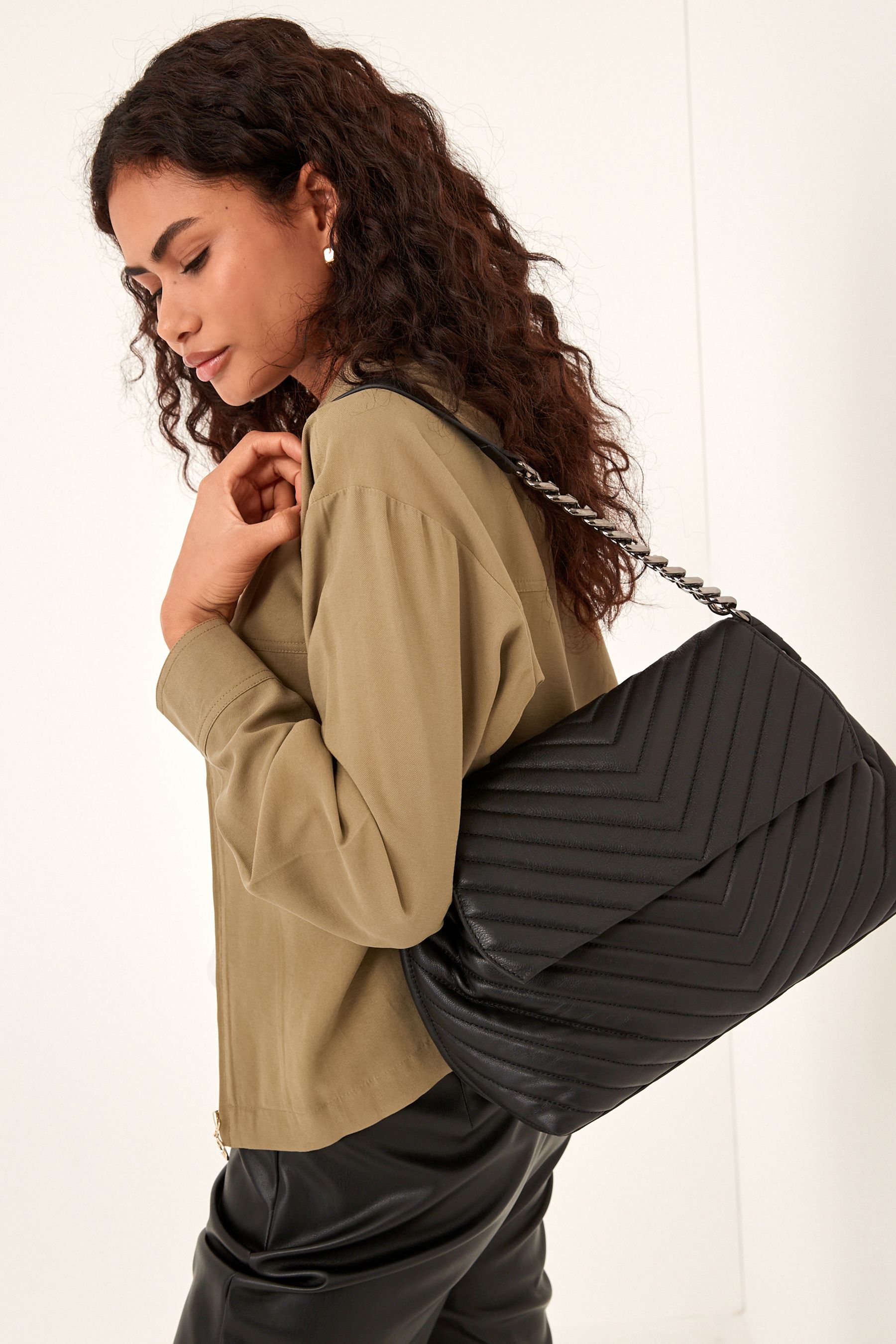 Buy Black Leather Quilted Chain Shoulder Bag from the Next UK