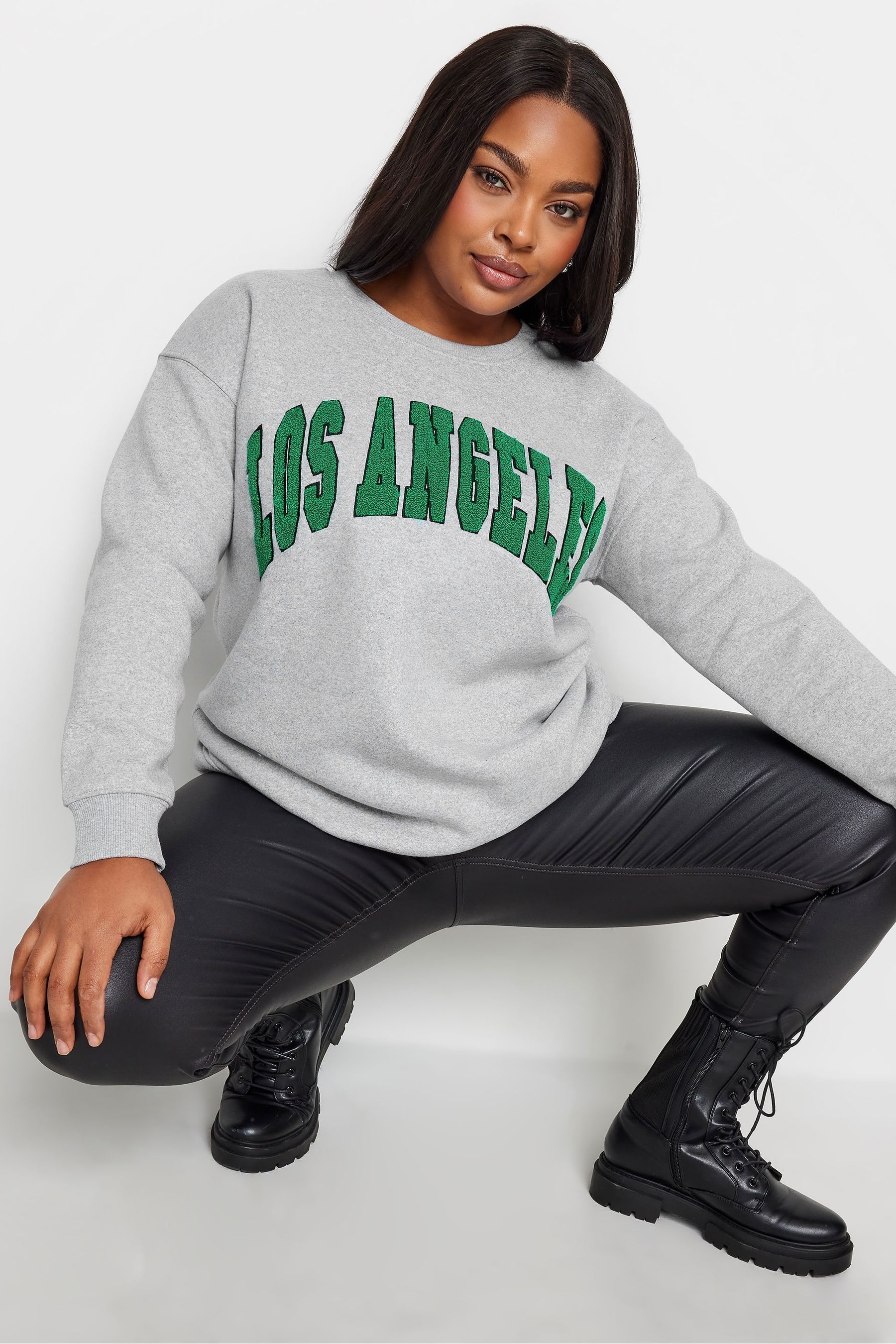 Embroidered store slogan sweatshirt