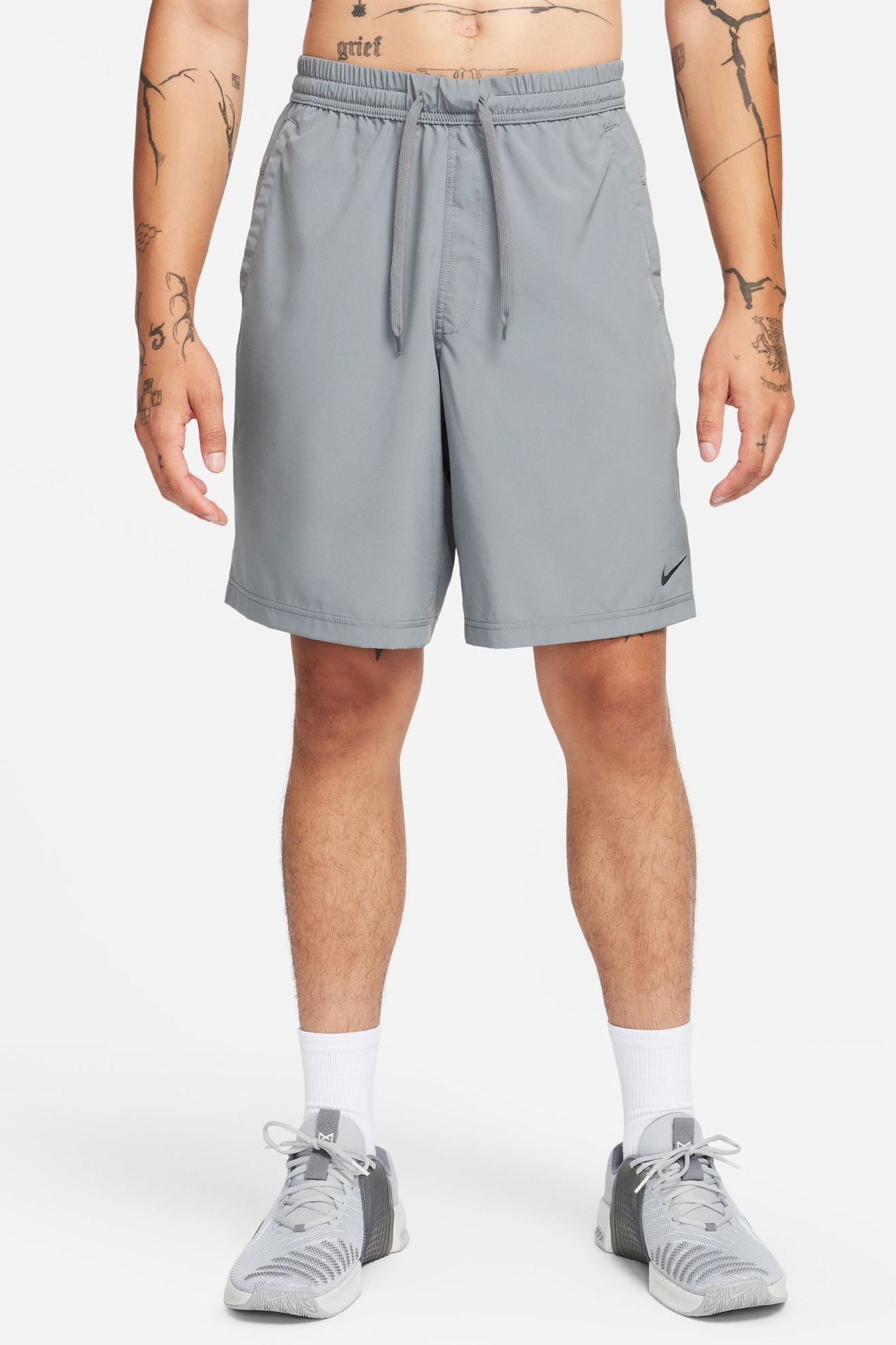 Buy Nike Grey Form Dri FIT 9 inch Unlined Versatile Shorts from the Next UK online shop