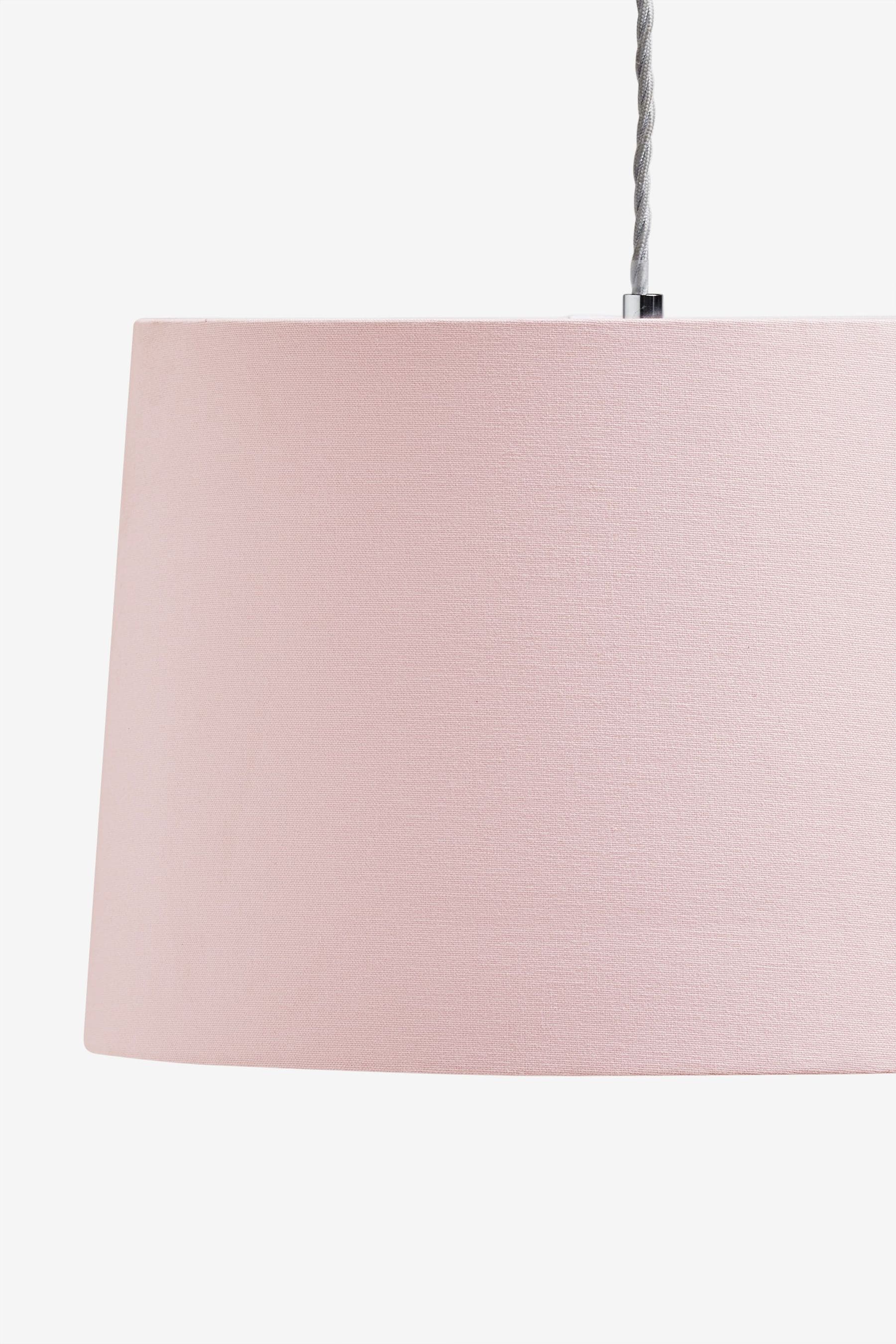Gold lamp outlet with pink shade
