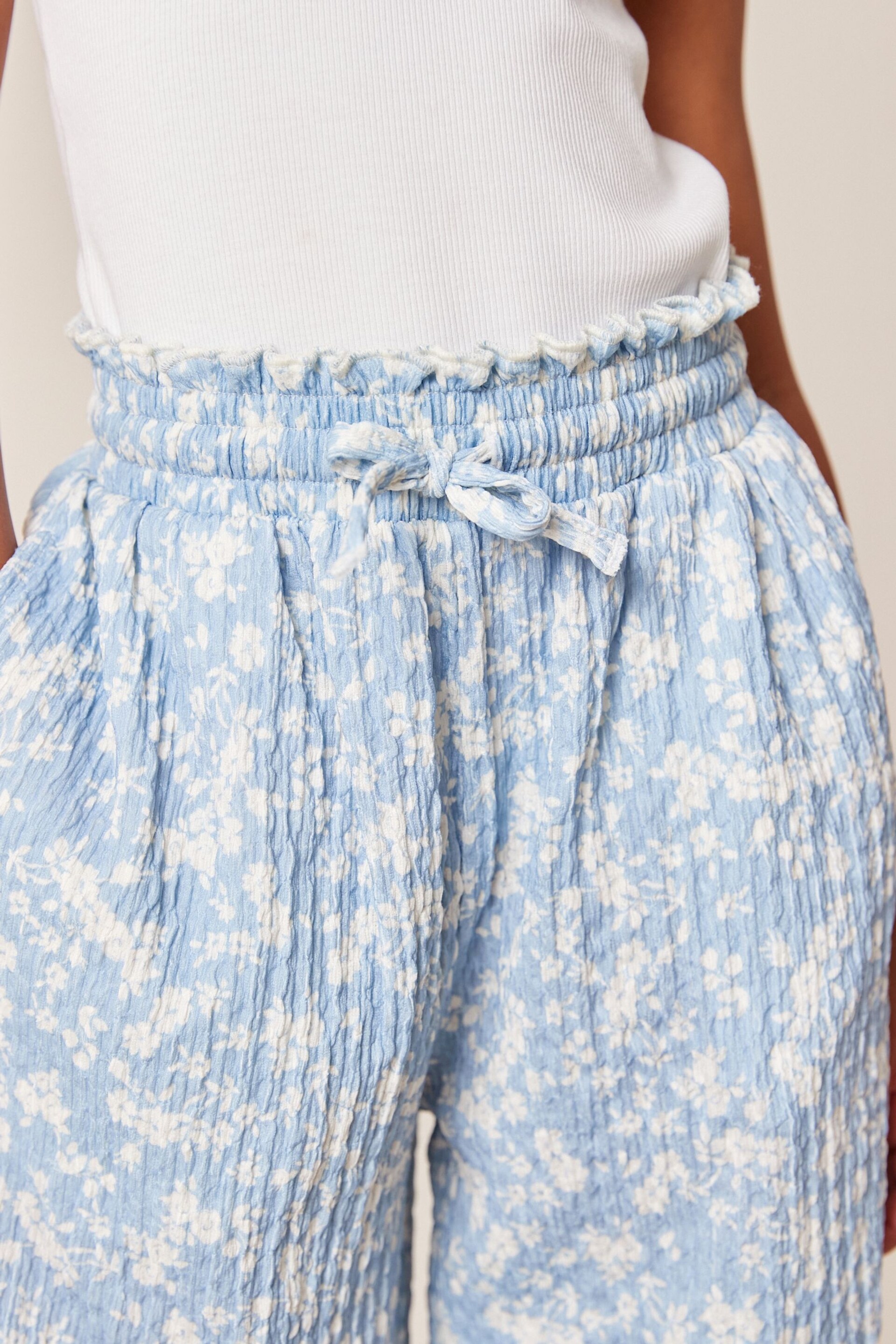 Blue/ White Floral Print Crinkle Texture Jersey Wide Leg Trousers (3-16yrs) - Image 3 of 6