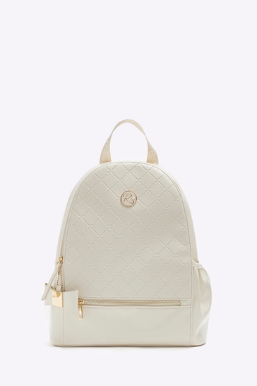 Buy River Island Cream Girls Embossed Bow Backpack from the Next UK ...