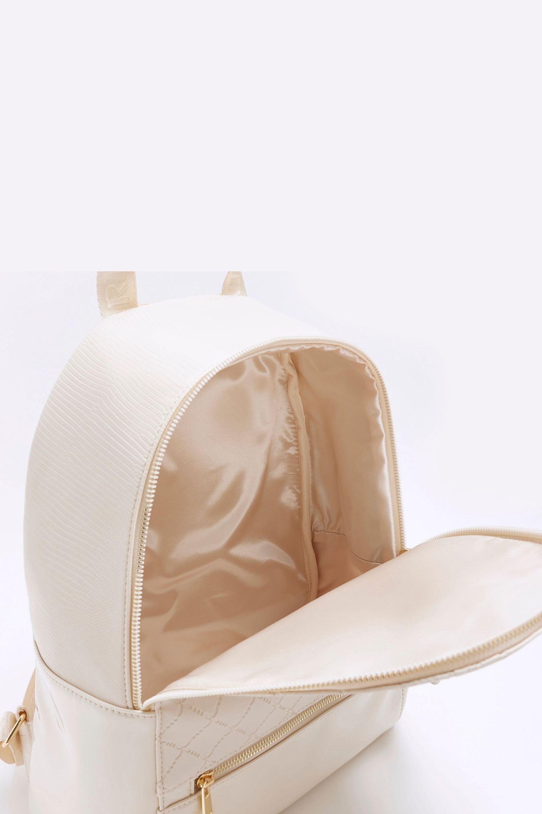 Buy River Island Cream Girls Embossed Bow Backpack from the Next UK online shop