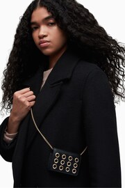 AllSaints Black Tallulah Eye Cross-Body Bag - Image 1 of 7