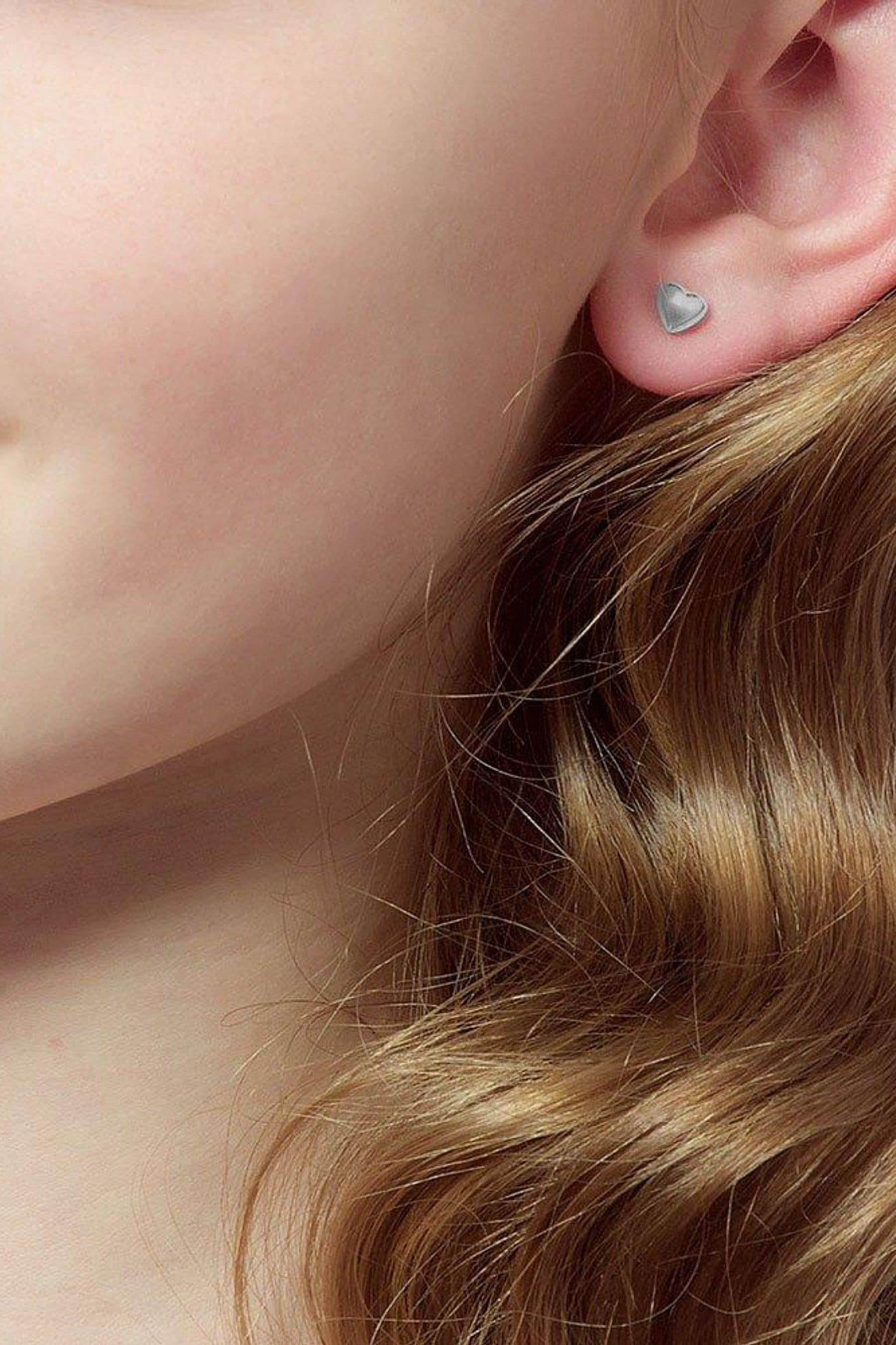 Buy Beaverbrooks Children s Mini B Silver Heart Earrings from the Next UK online shop