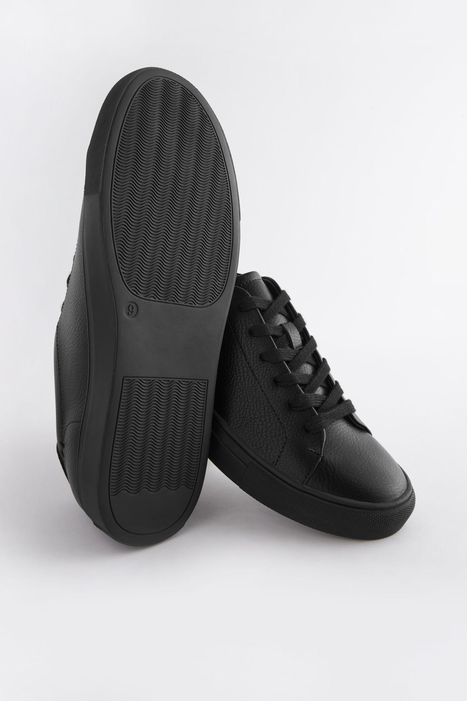 Minimalist black sneakers top
