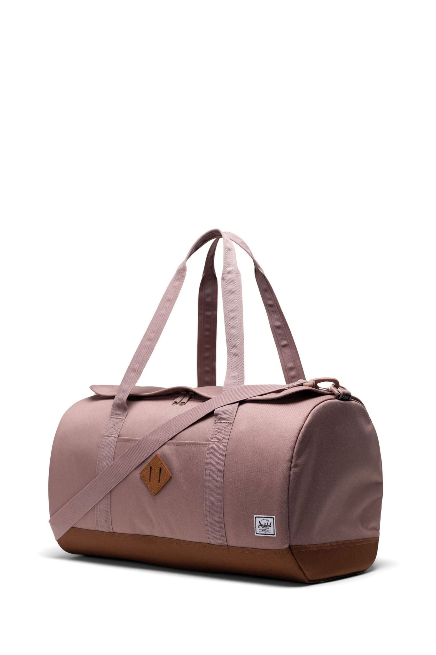 Pink herschel 2025 duffle bag