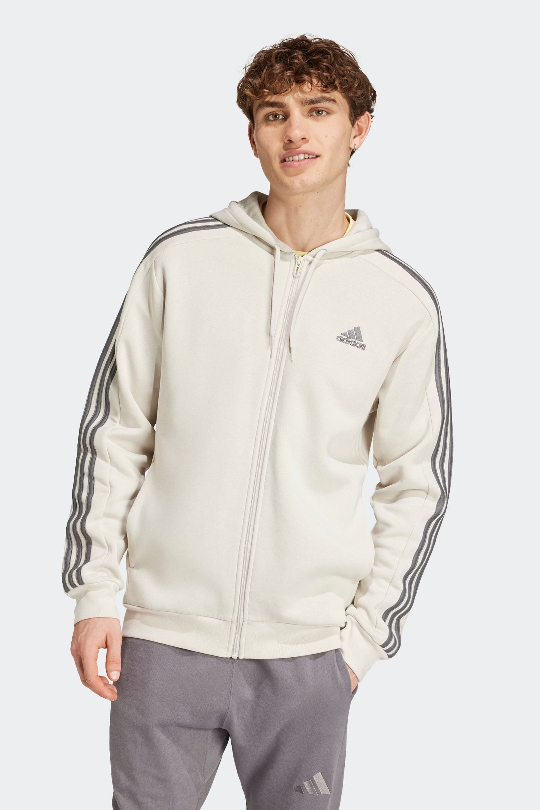 Buy adidas Brown Essentials Fleece 3 Stripes Zip Up Hoodie from Next Luxembourg