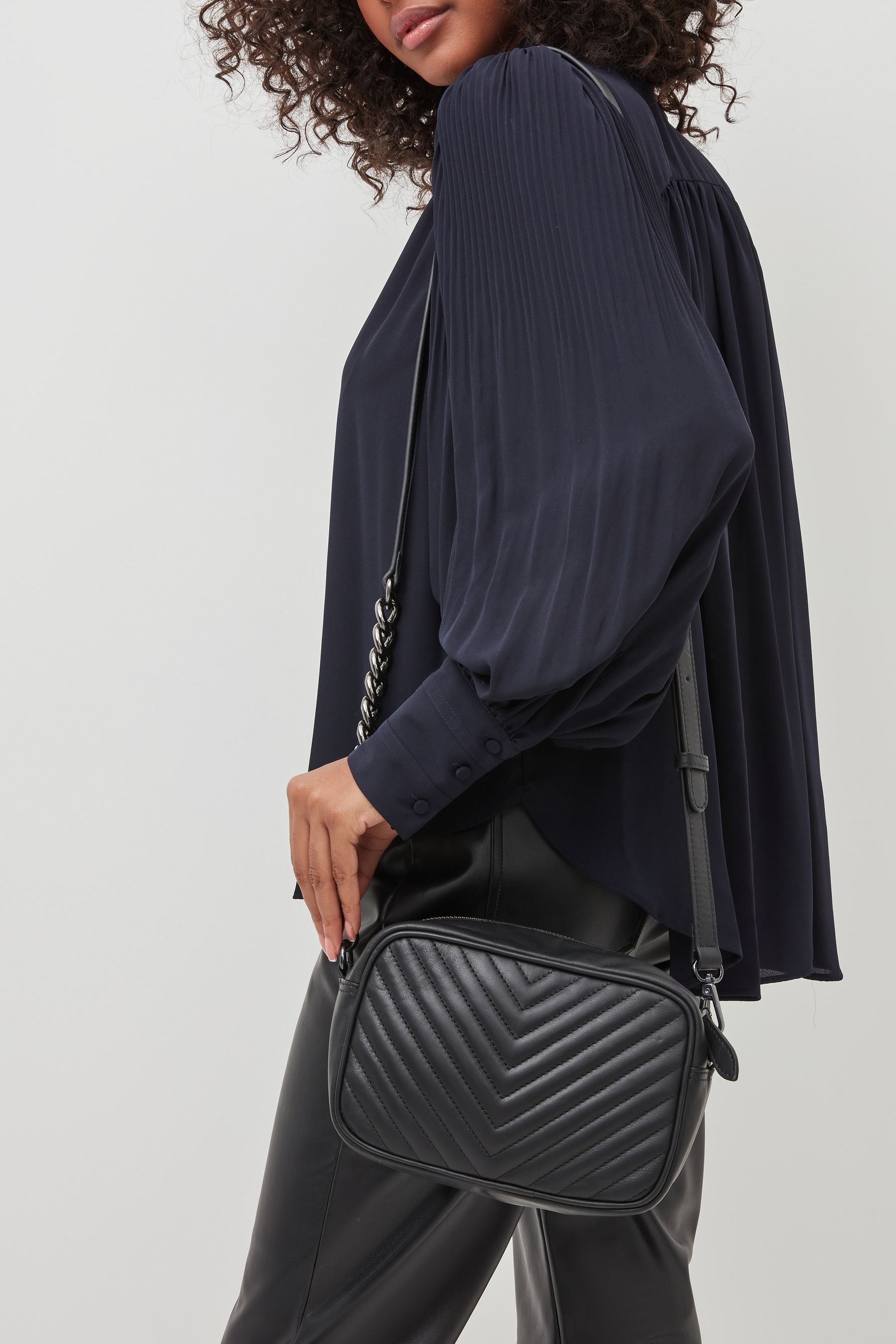 Black quilted camera bag on sale