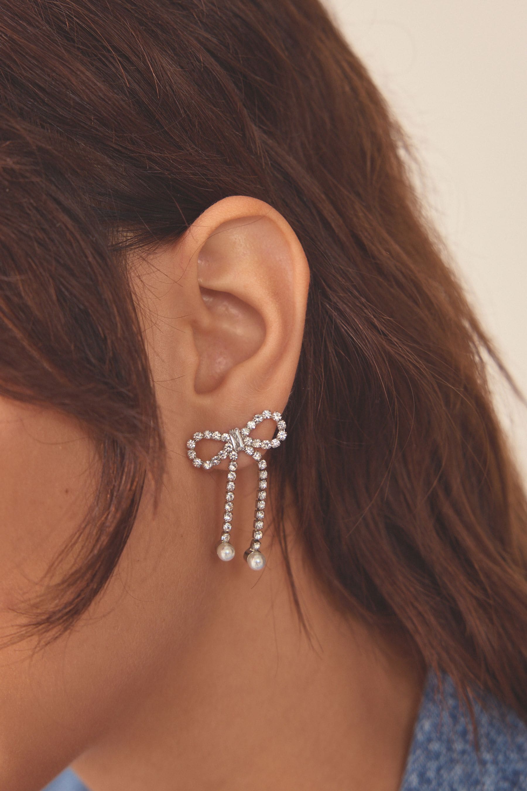 Buy Silver Tone Sparkle Bow Earrings Made With Recycled Brass from Next Luxembourg