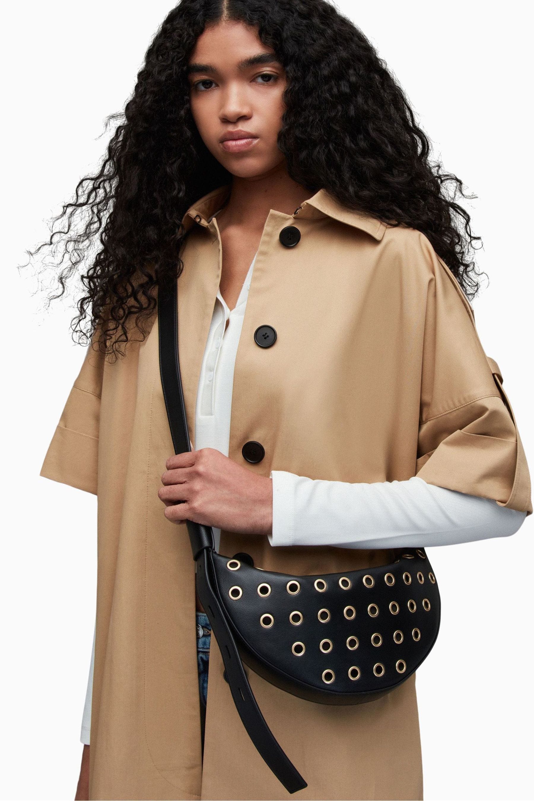 Buy AllSaints Black Half Moon Eyelet Bag from Next Luxembourg