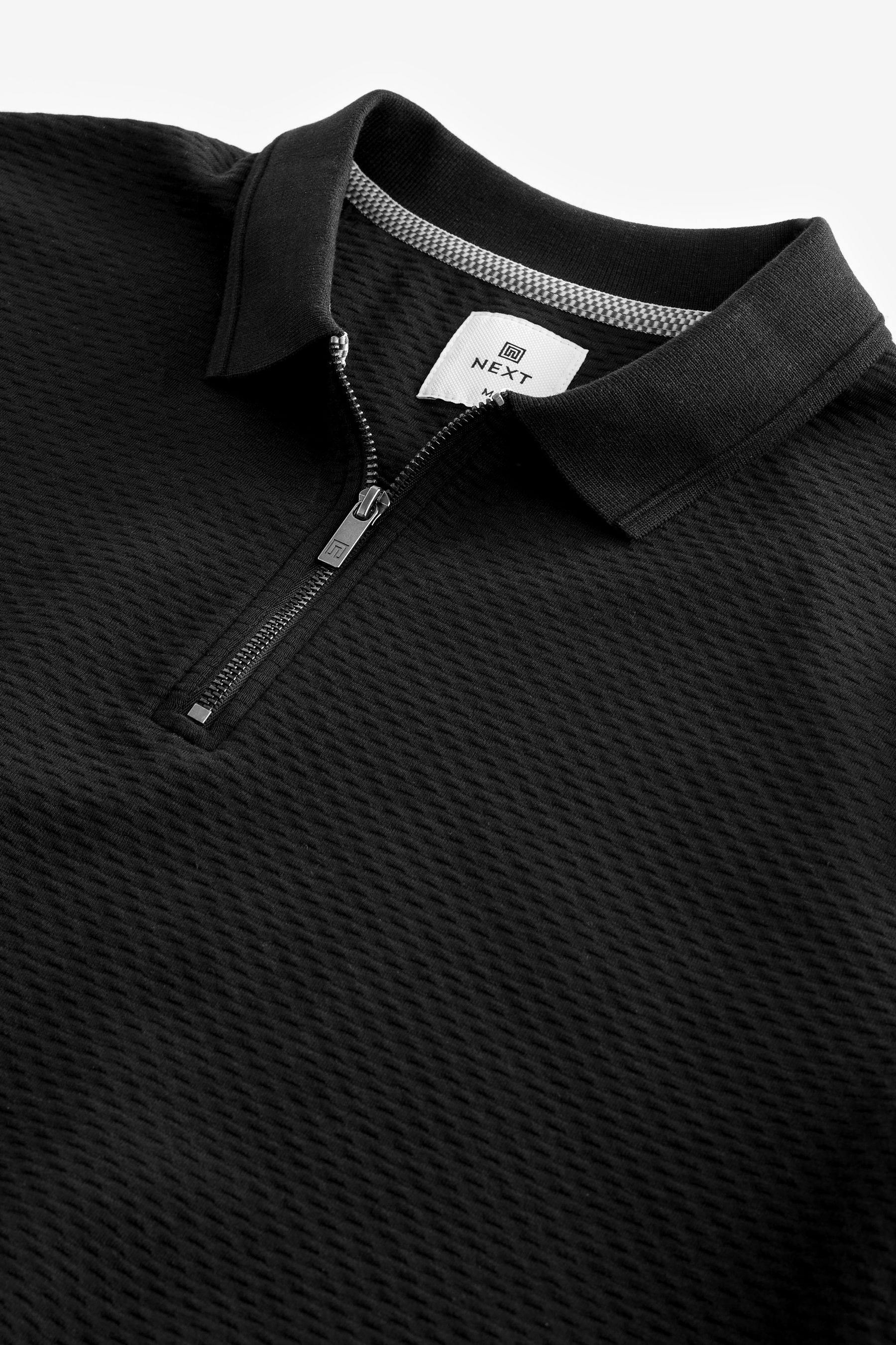 Buy Black Short Sleeve Textured Quarter Zip Polo Shirt from Next Ireland