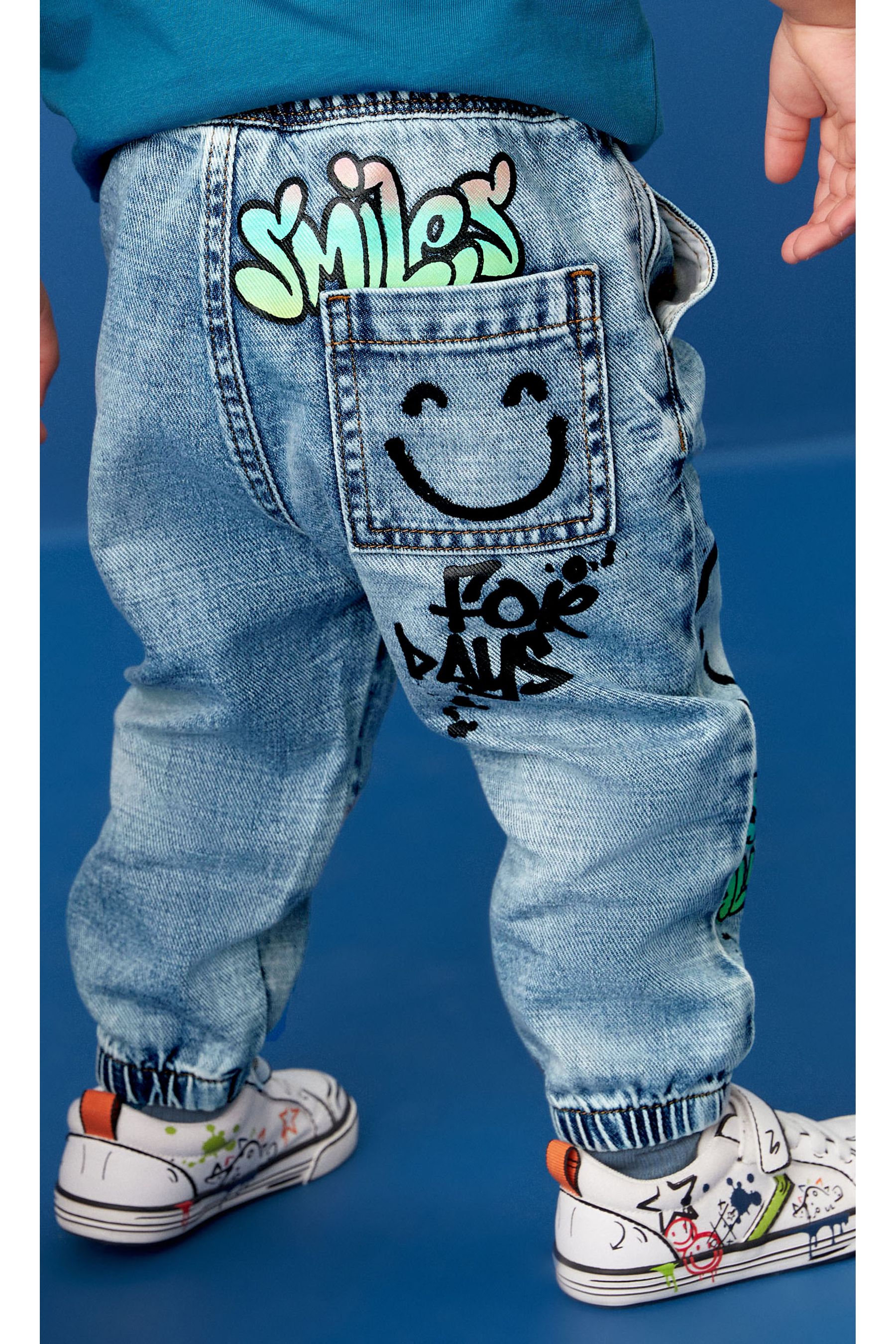 Buy Light Blue Denim Graffiti Print Jeans 3mths 7yrs from the