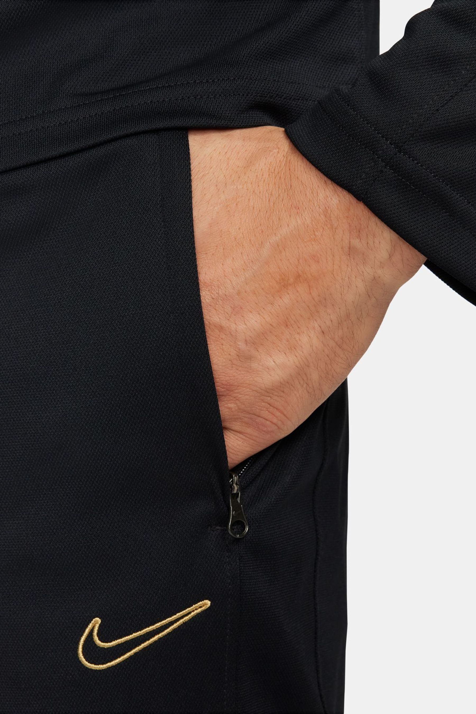 Black and gold nike tracksuit online