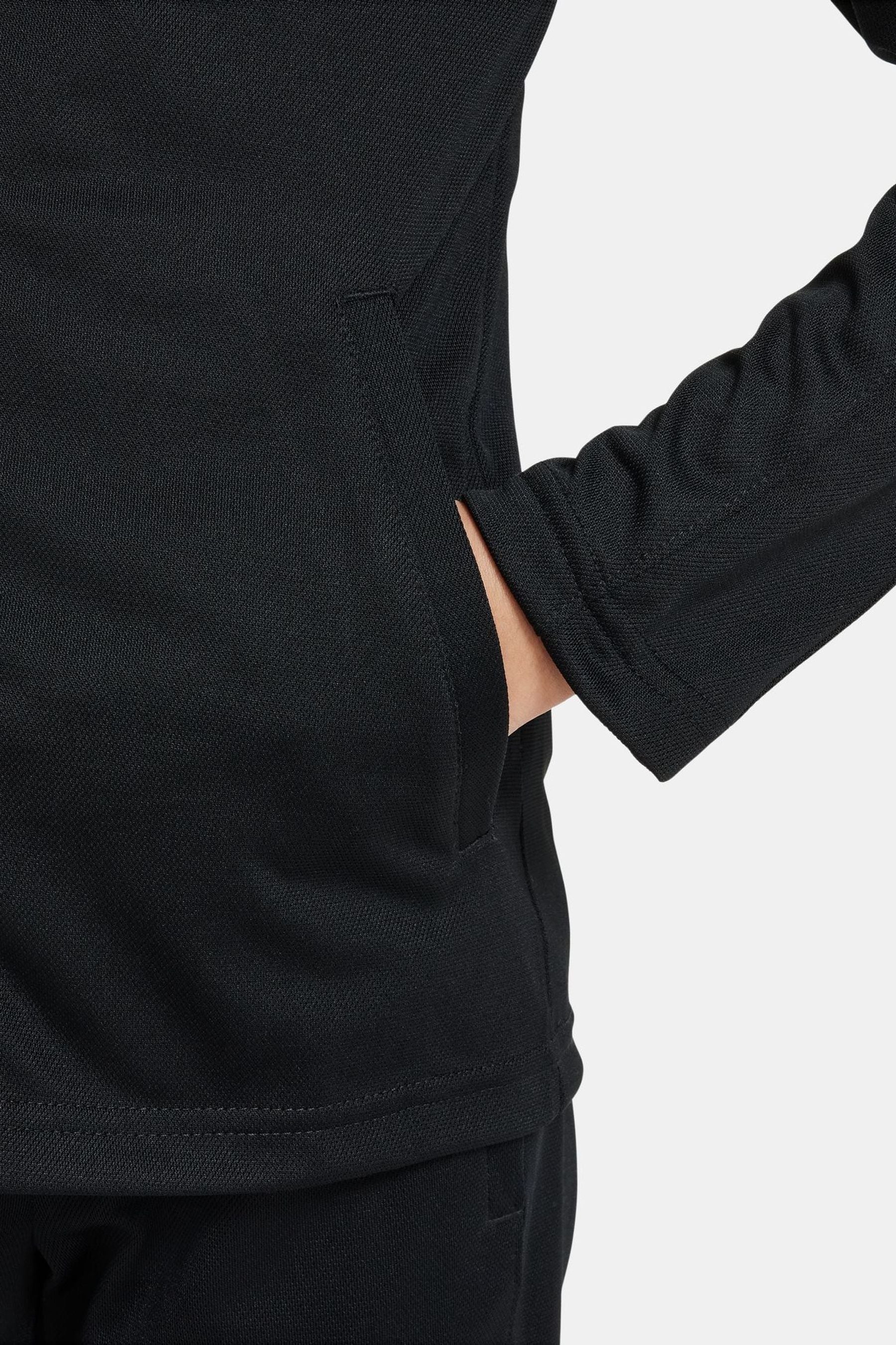 Nike tracksuit discount black and gold