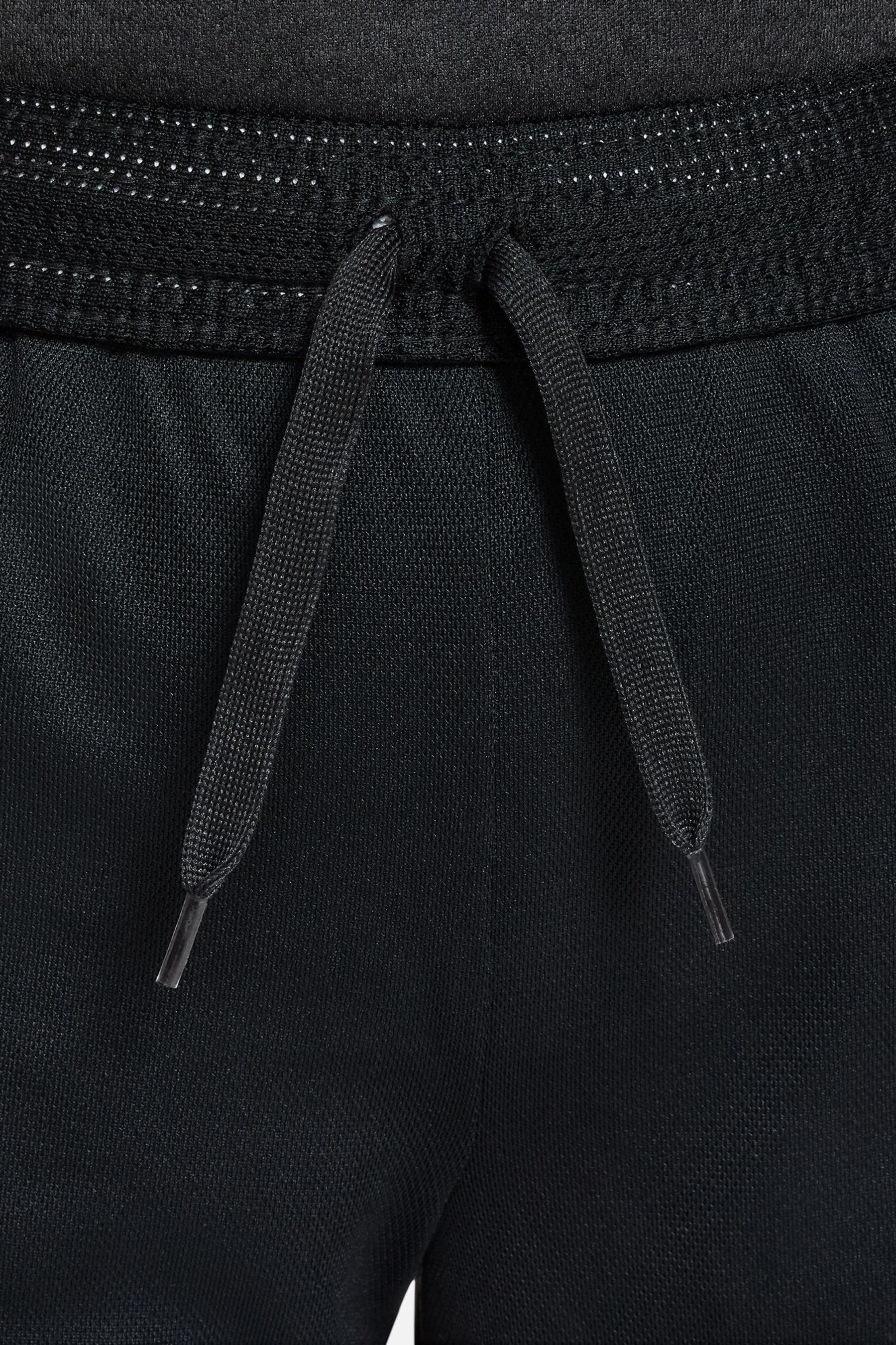 Nike black and gold tracksuit on sale