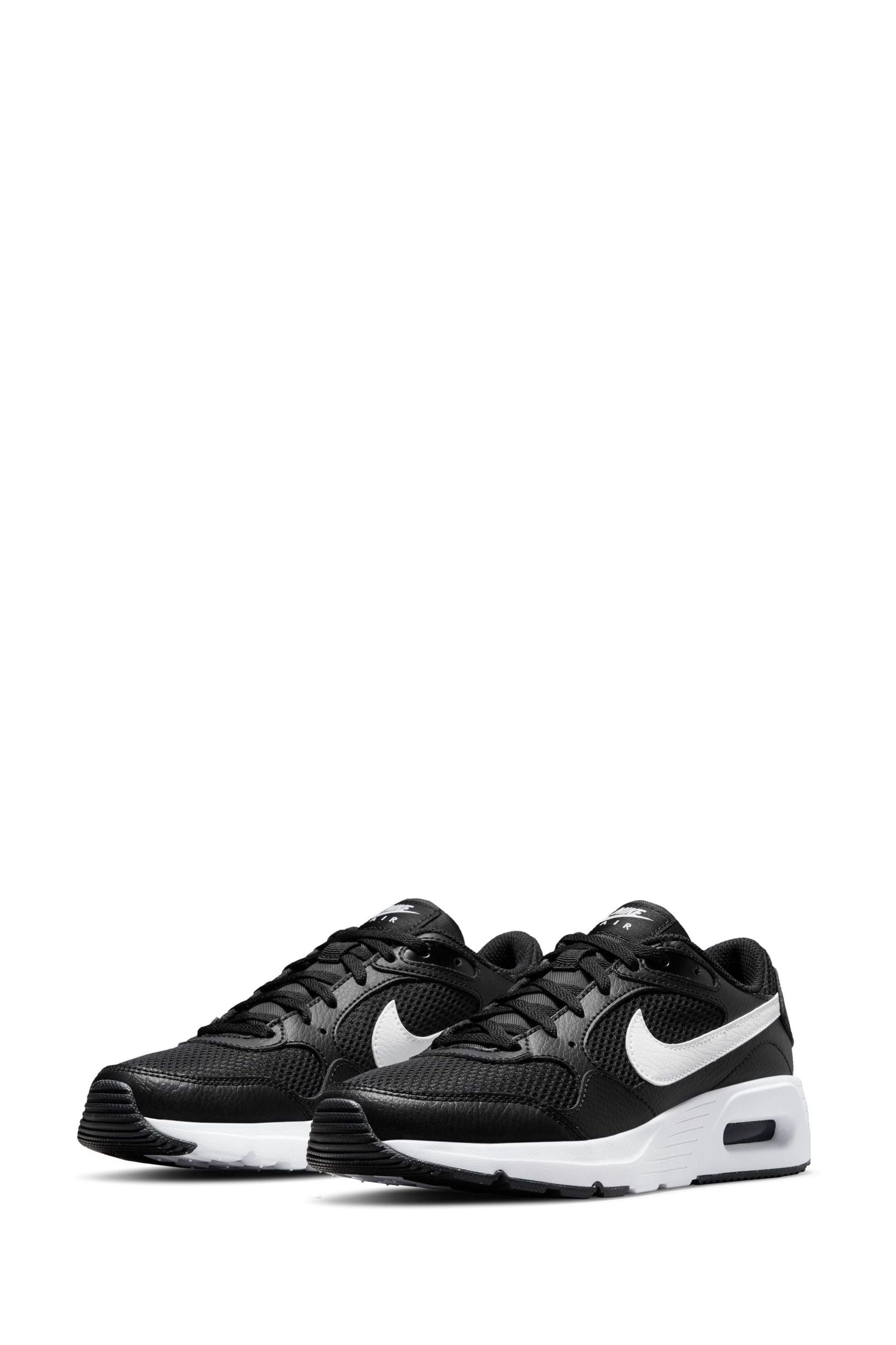 Nike black & shop white air vortex trainers