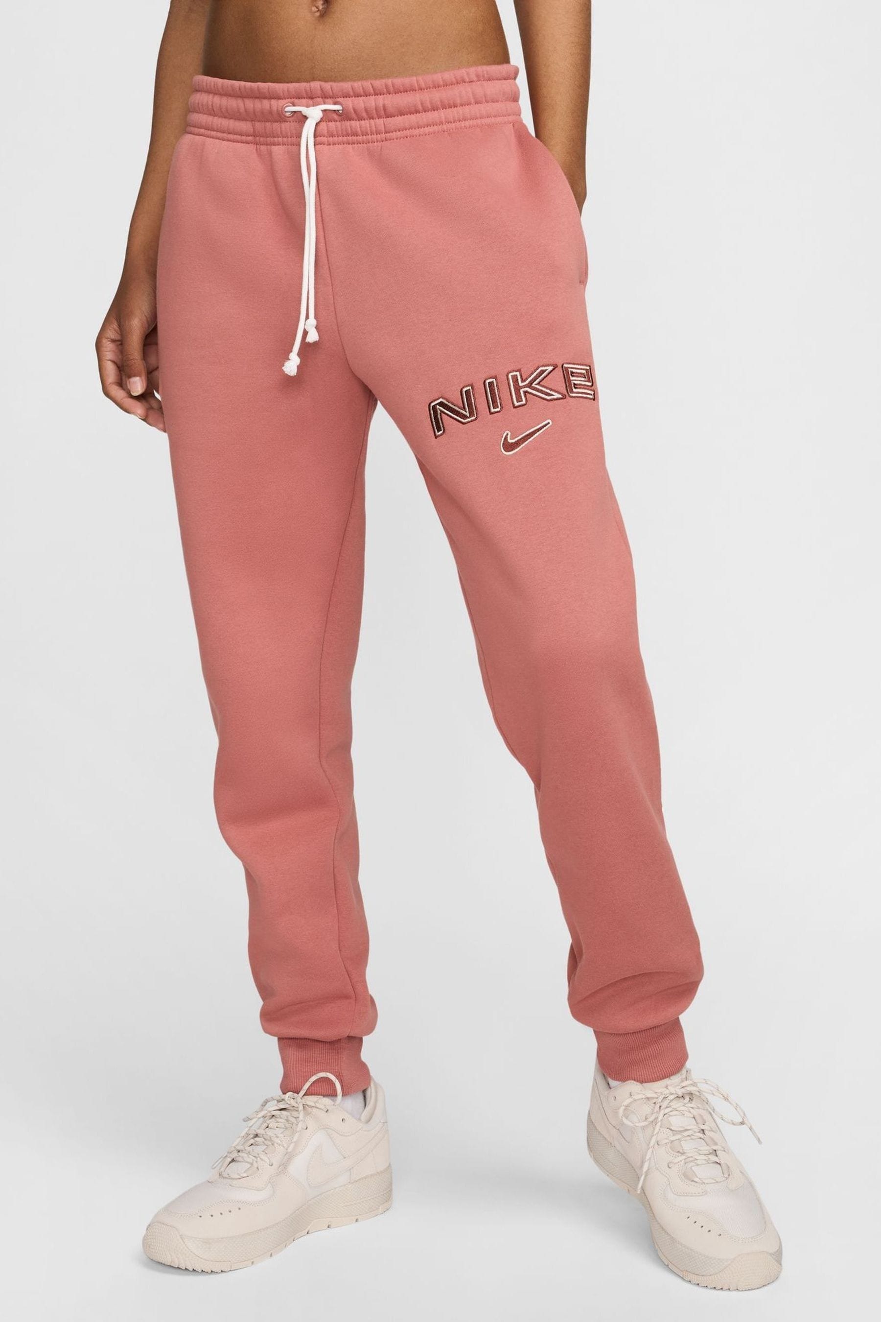 Buy Nike Pink Phoenix Fleece Mid Rise Logo Joggers from the Next UK online shop