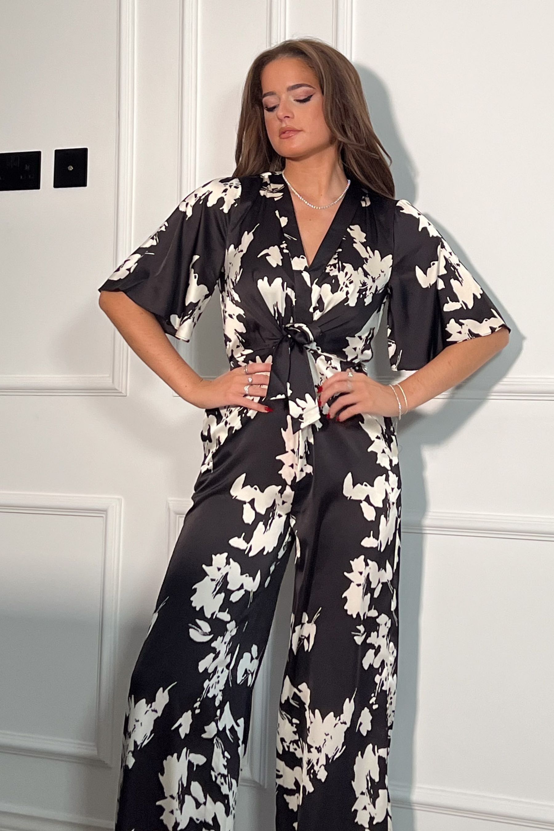 White floral jumpsuit on sale