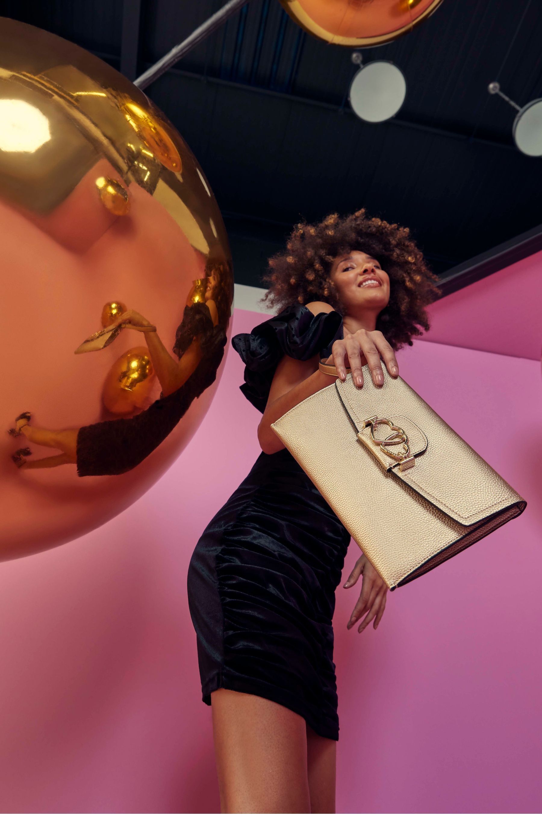 Buy Fiorelli Gold Eros Envelope Pouch Plain Clutch from the Next