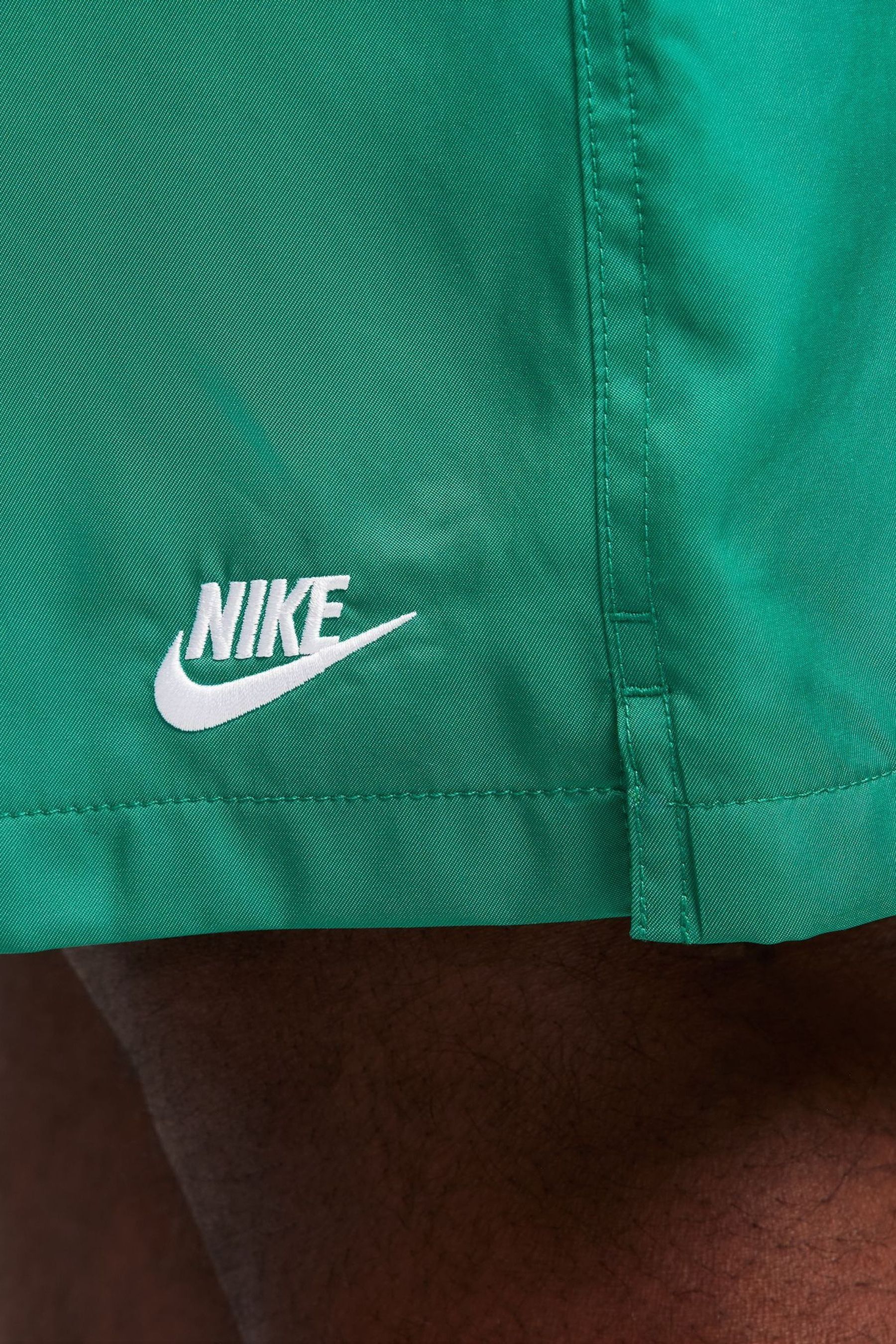 Nike flow shorts green top