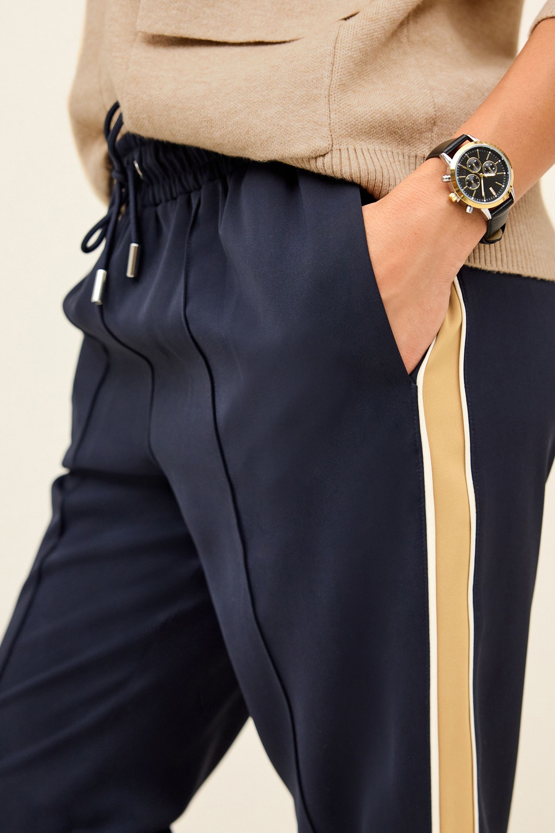 Trousers with gold side outlet stripe