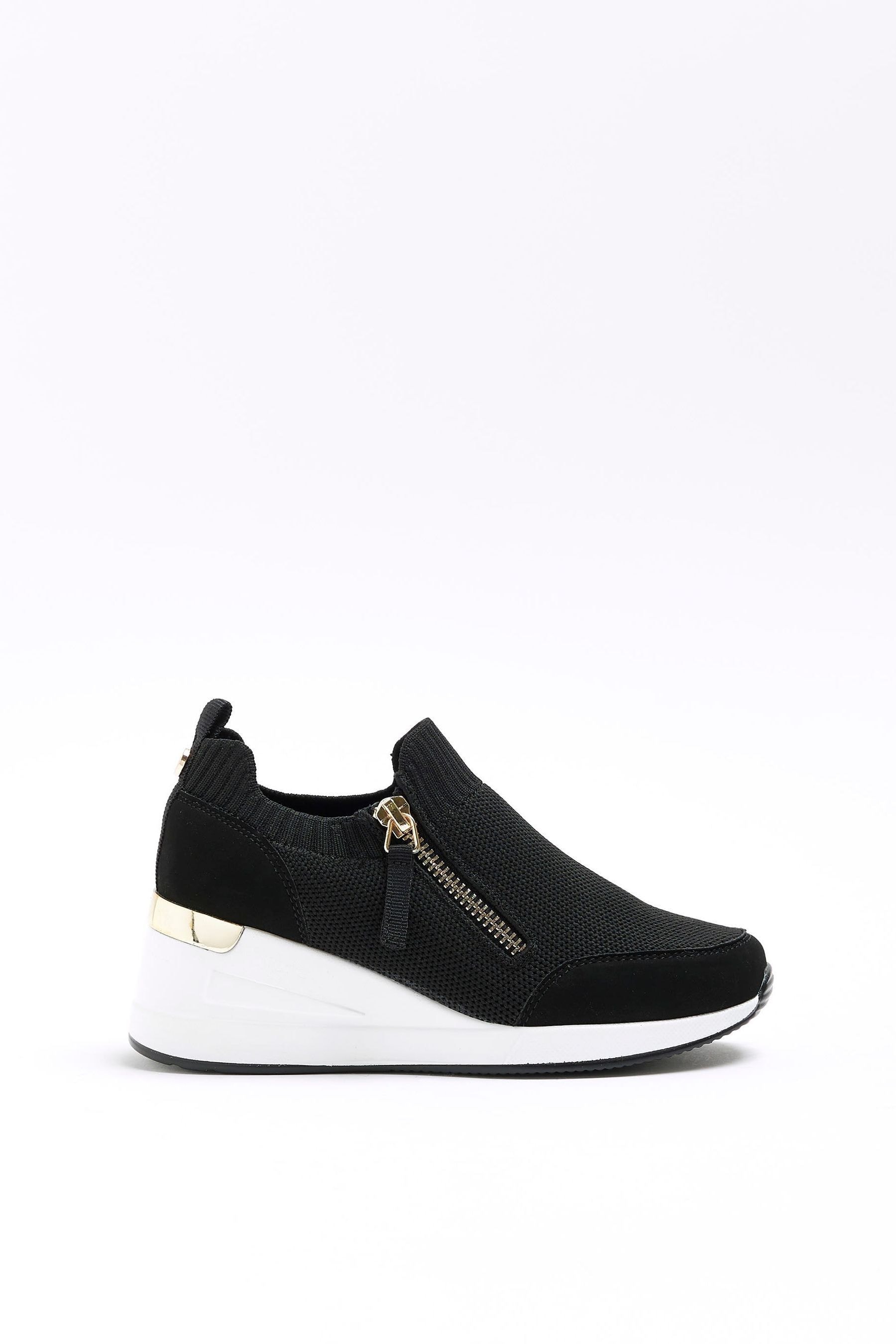 Nike black wedge trainers 2025