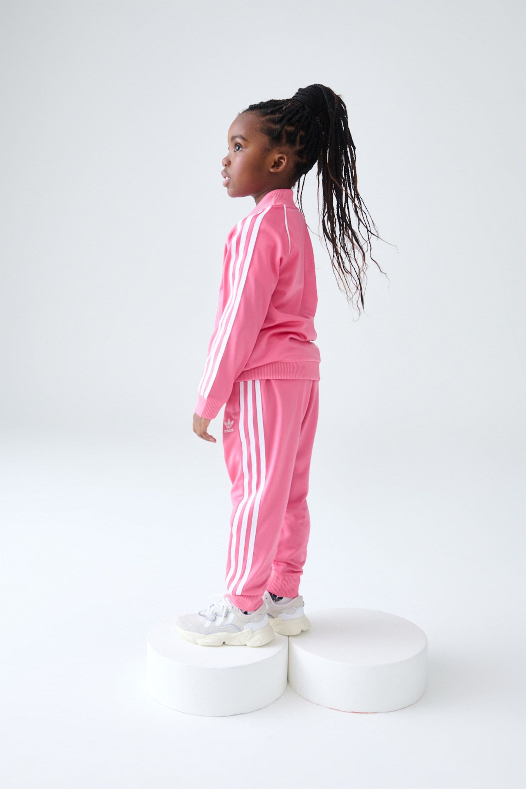 Girl pink adidas tracksuit hot sale