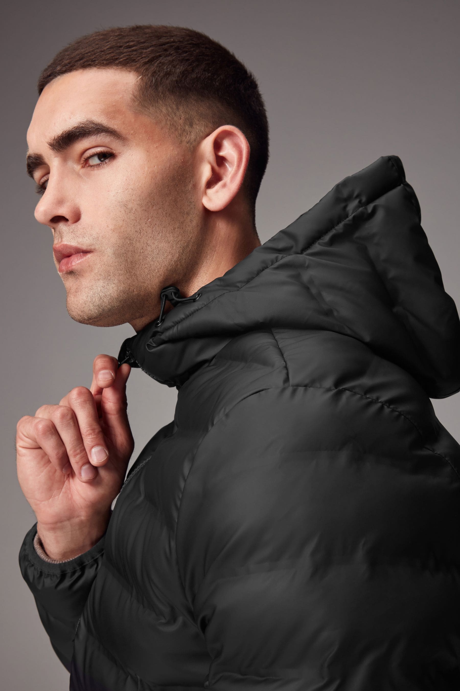 Buy Black Shower Resistant Rubberised Hooded Puffer Coat from Next Ireland