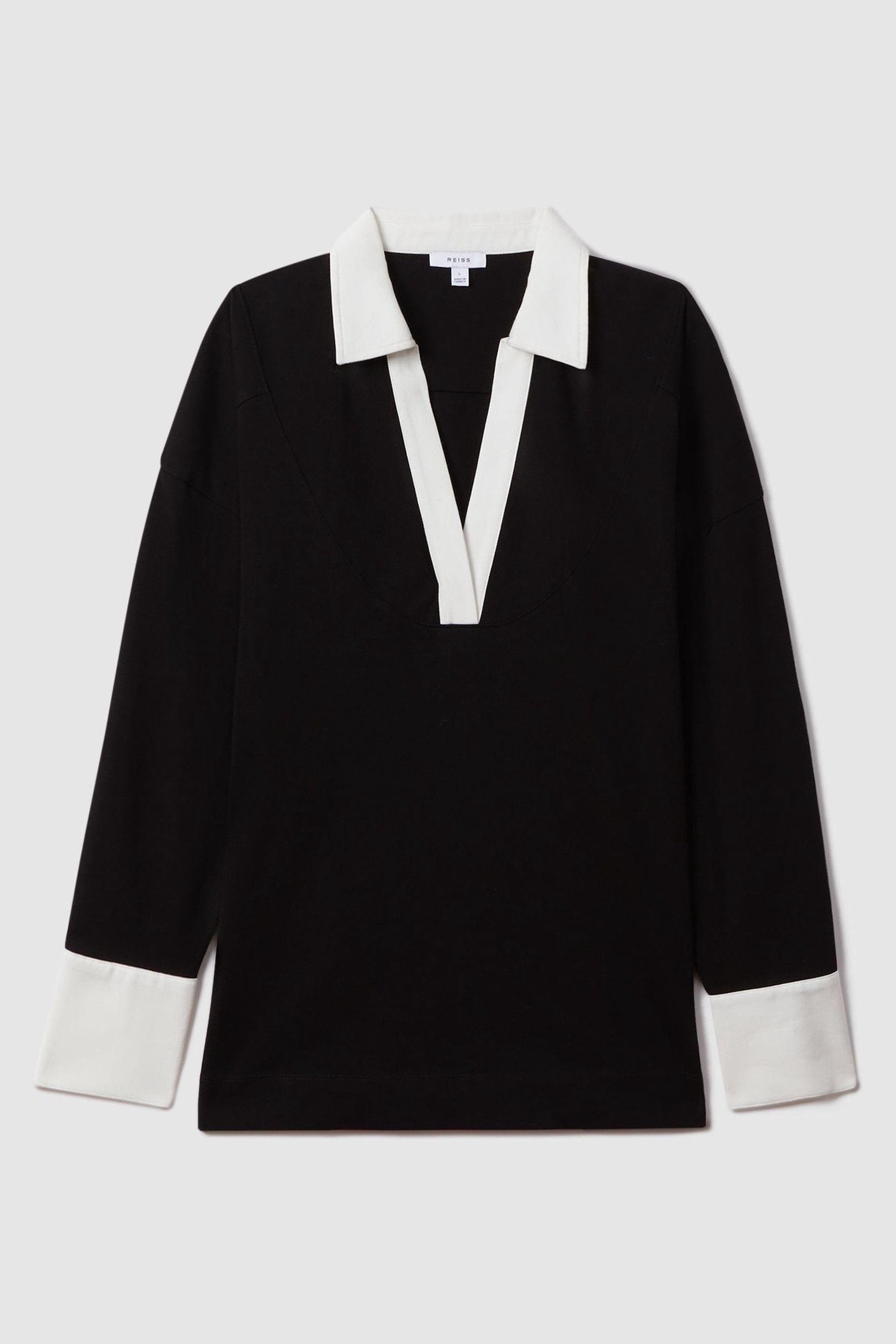 Black jumper with white collar outlet