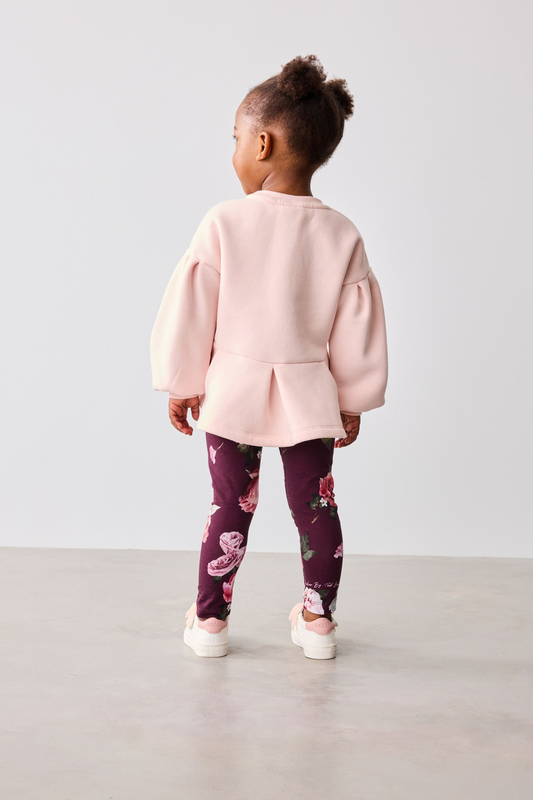 Pink peplum sweater shop