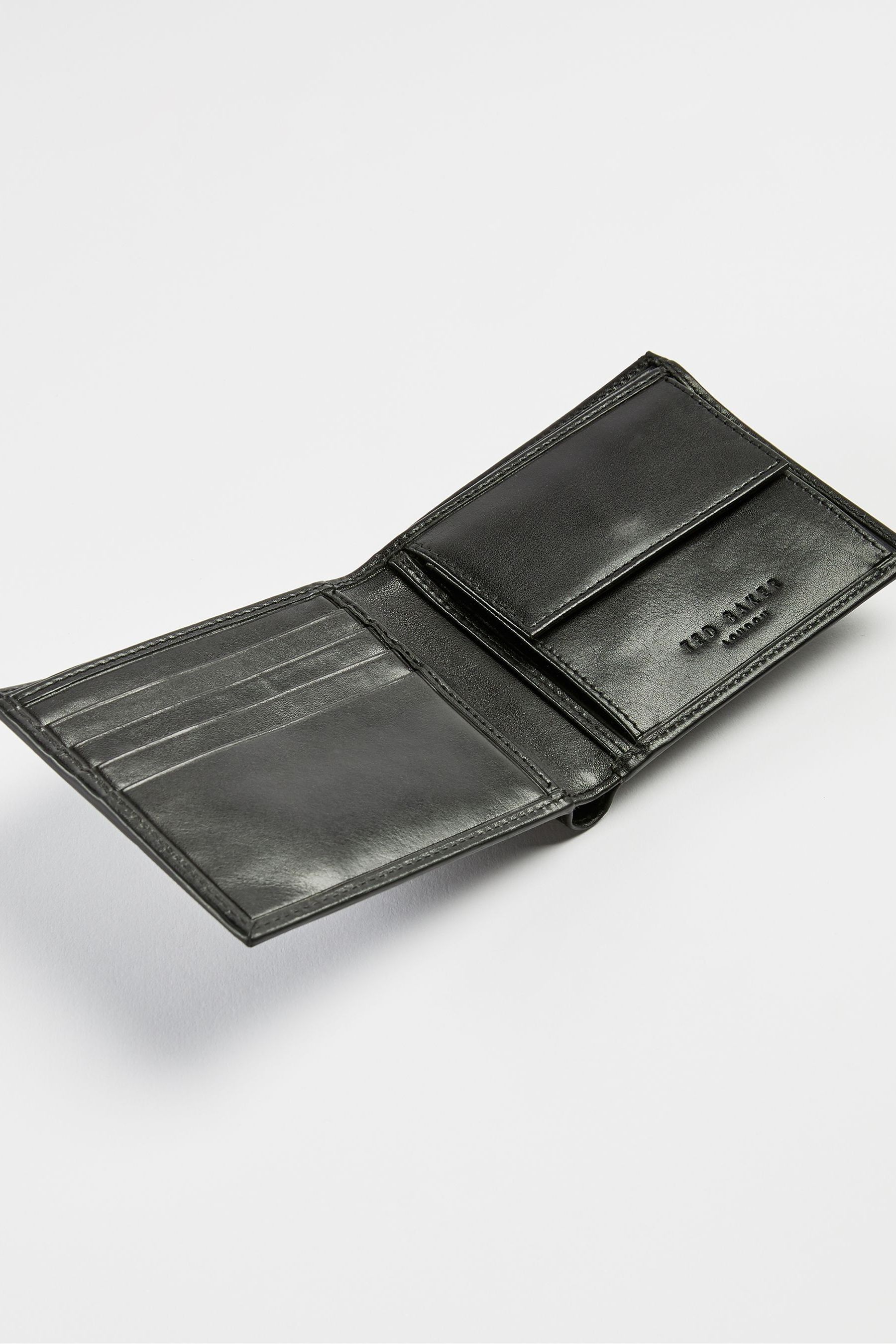Buy Ted Baker Black Prug Embossed Corner Leather Bifold Wallet With Coin from Next United Arab Emirates