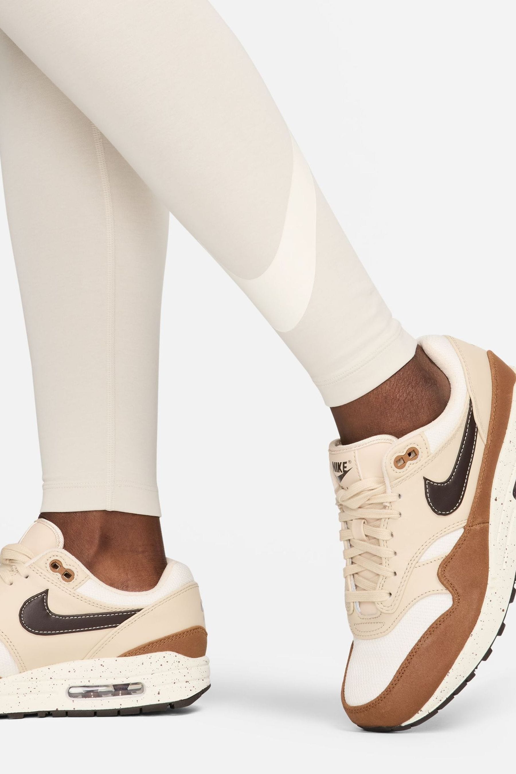 Buy Nike Light Wood Natural Sportswear Swoosh Leggings from the Next UK online shop