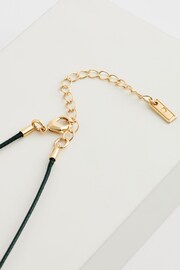 Gold Tone Wave Drop Black Cord Necklace Made with Recycled Metal - Image 4 of 4