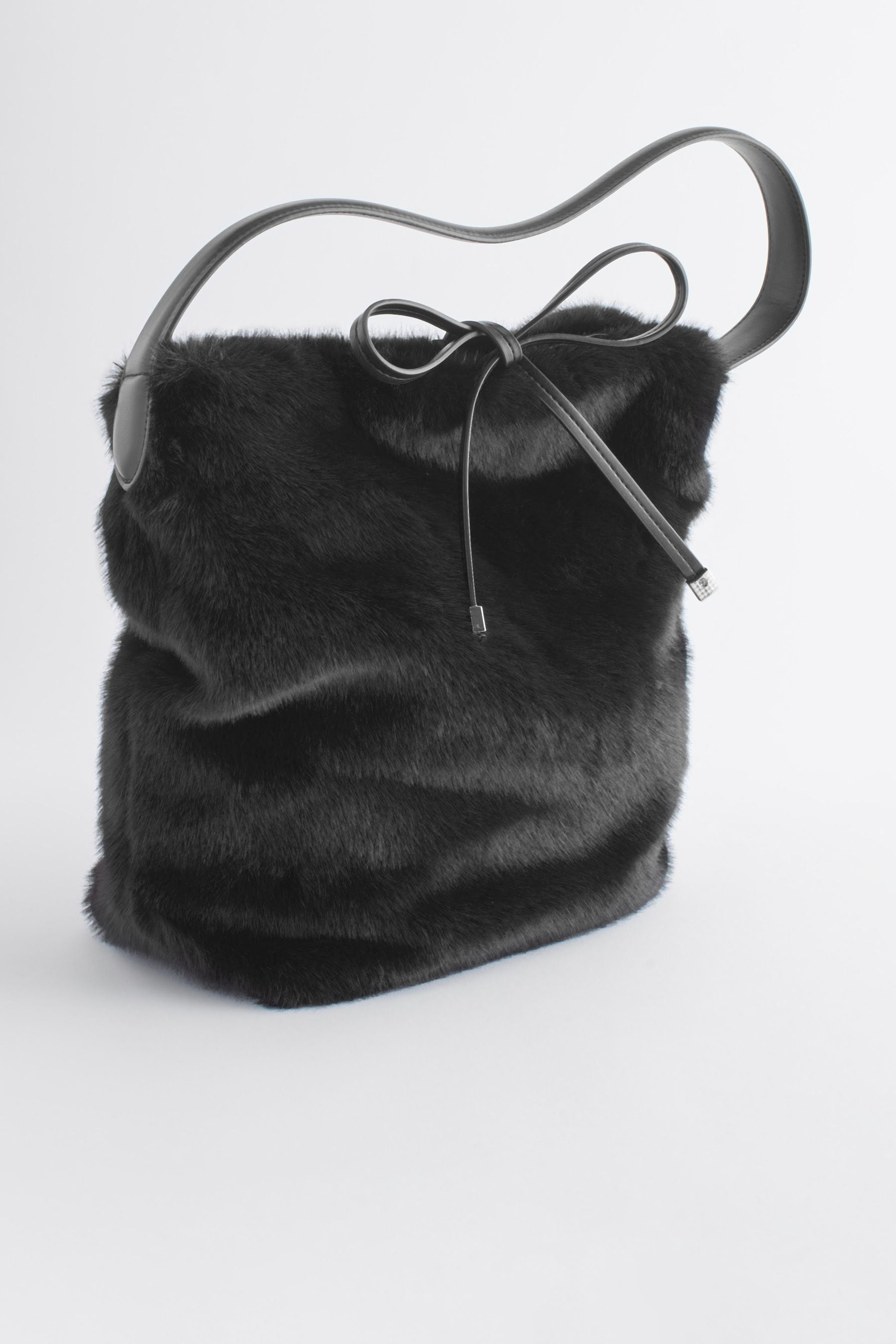 Black fluffy handbag store