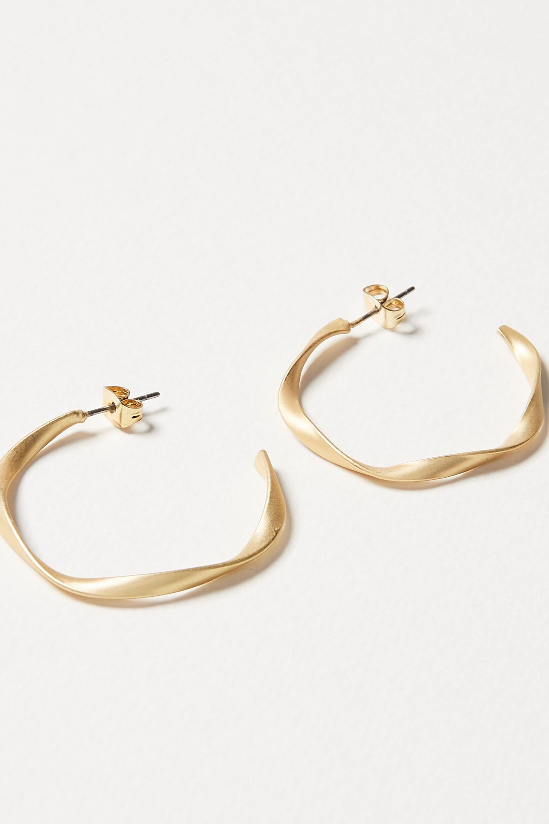 Buy Oliver Bonas Gold Tone Patti Matte Twist Hoop Earrings from the Next UK online shop